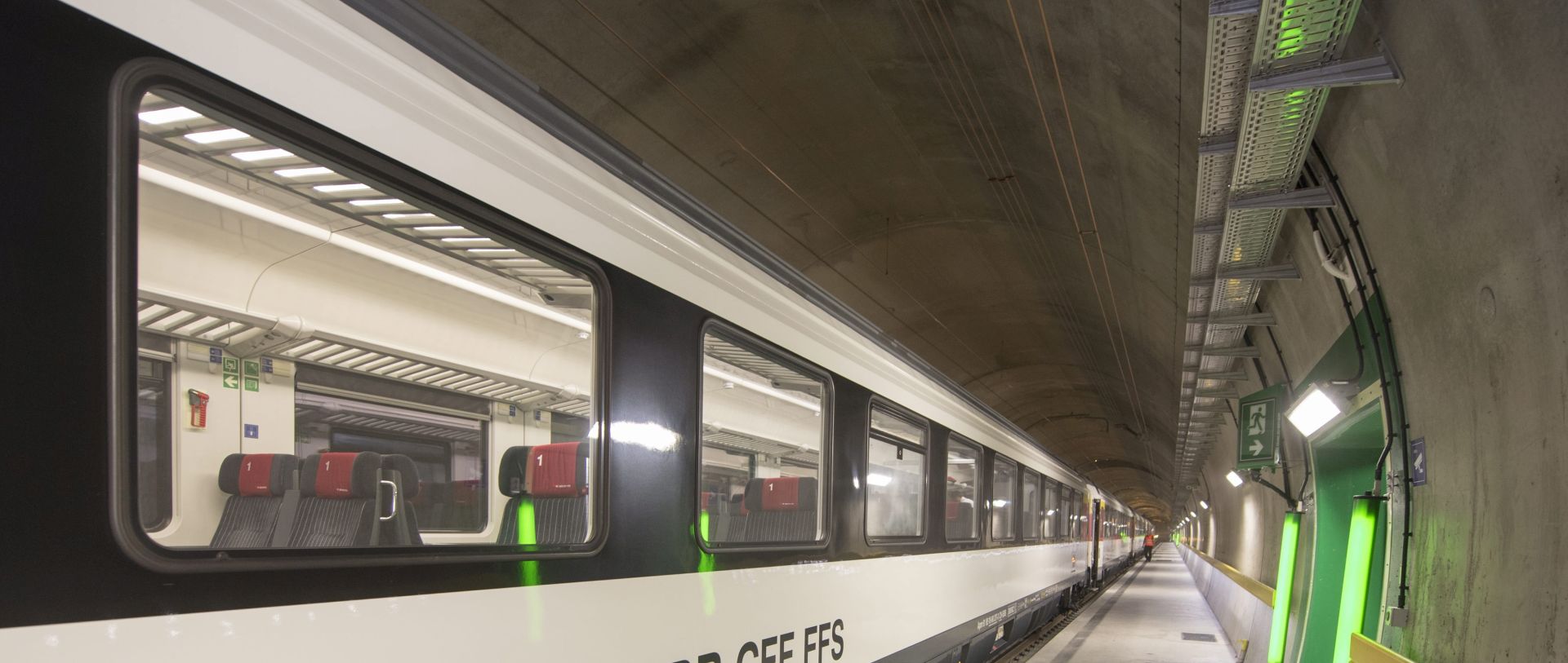 epa05453554 A train stands in the Gotthard base tunnel, during a media event of the Swiss Railway SBB, a drive-through from north (Erstfeld) to south (Biasca) through the Gotthard rail tunnel, the longest tunnel in the world, in Switzerland, 04 August 2016. The construction of the 57 kilometer long tunnel began in 1999, the breakthrough was in 2010. After the official opening in June, the commercial opperation will commence on December 2016.  EPA/URS FLUEELER