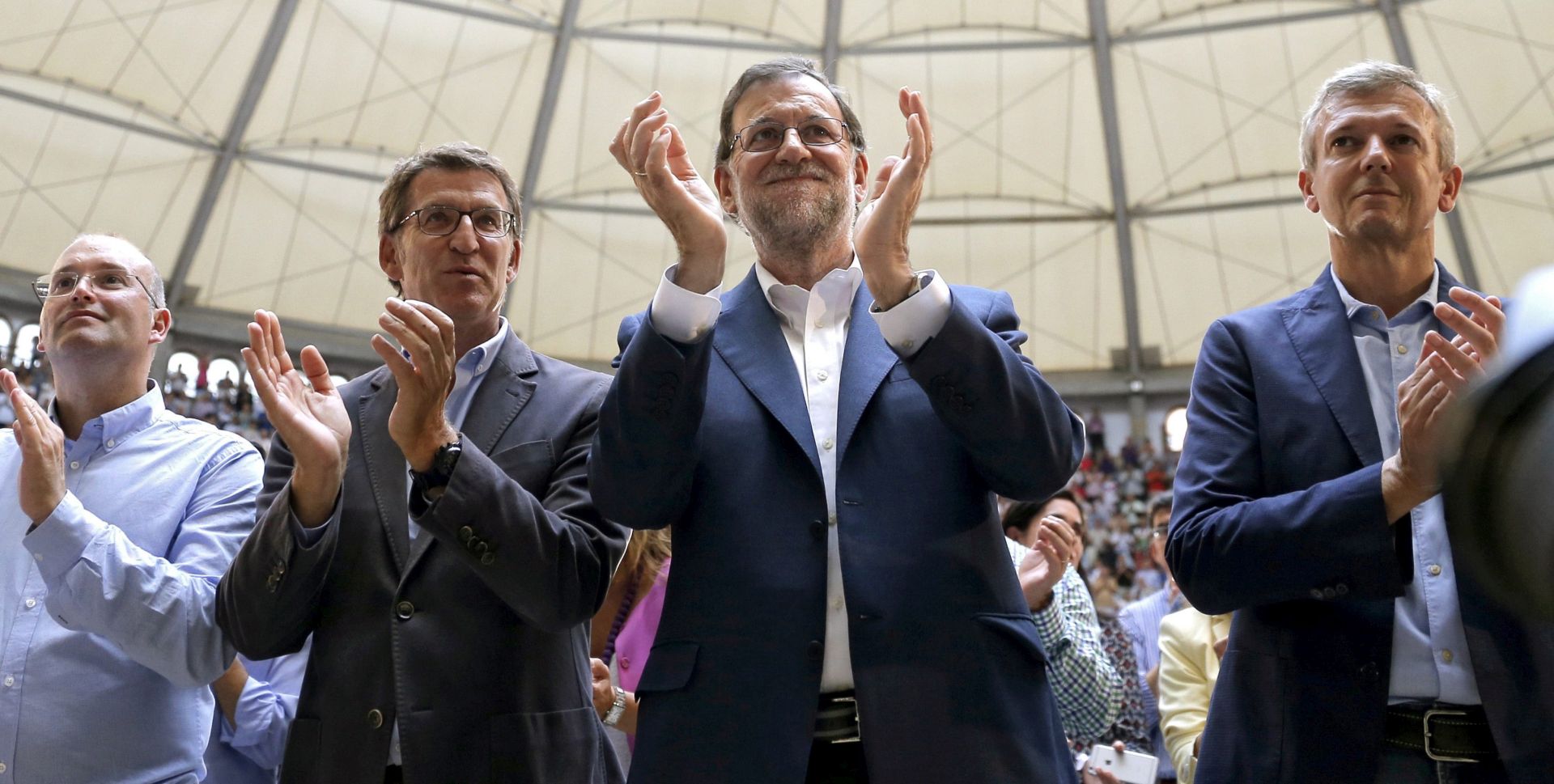 epa05533709 Spanish acting Prime Minister Mariano Rajoy (2-R), leader of the Galician Popula Party (PP) and candidate for re-election Alberto Nunez Feijoo (2-L), PP's Secretary General in Galicia Miguel Tellado (L), and PP's President in Pontevedra Alfonso Rueda (R) attend an election campaign event in Pontevedra, Galicia, Spain, 10 September 2016. Galicia's regional parliamentary election will be held on 25 September 2016.  EPA/LAVANDEIRA JR