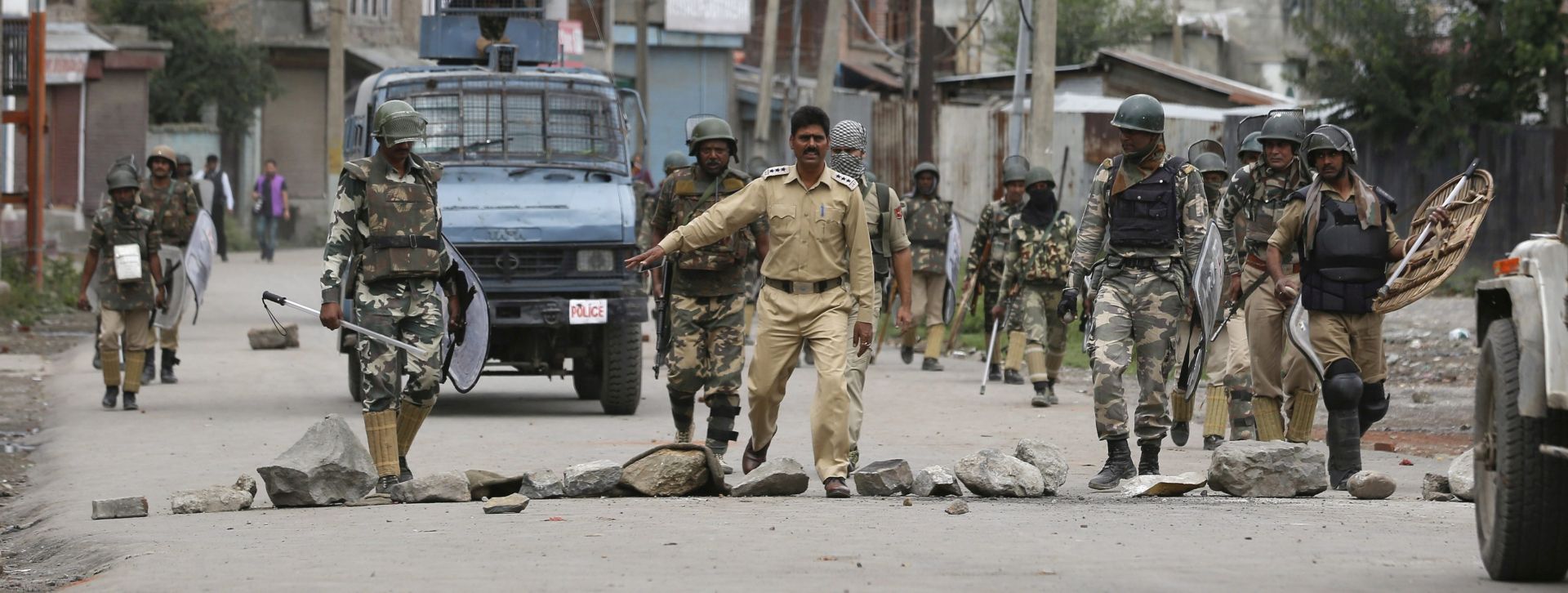 epa05514973 Indian paramilitary forces and police patrol during clashes in Batamaloo area of Srinagar, the summer capital of Indian Kashmir, 30 August 2016. Clashes broke out in some parts of Srinagar between Indian paramilitary forces, Police and Kashmiri Muslim youth. The government lifted curfew from most parts of the Valley barring Pulwama and some areas of Srinagar's downtown area but shutdown continued in Kashmir despite relaxation of curfew. During the 53 days of the ongoing summer unrest in Kashmir, passenger transport is off roads and over 65 people have been killed while more than 8,500 people have been injured following the killing of Hizb-ul-Mujahideen commander, Burhan Muzaffar Wani and his two associates in a gunfight on 08 July 2016.  EPA/FAROOQ KHAN