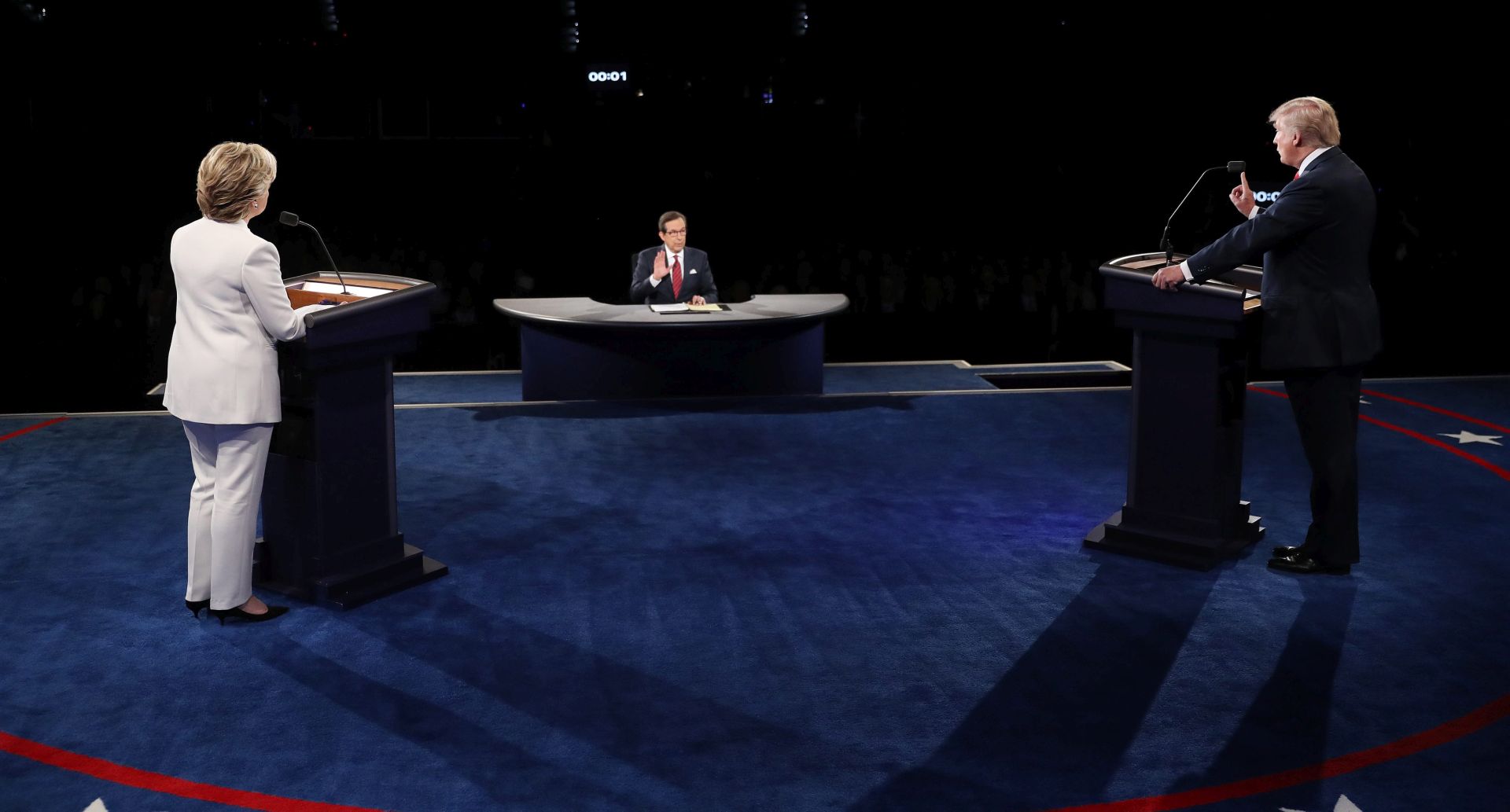 epa05593063 Democratic candidate Hillary Clinton (L) and Republican candidate Donald Trump (R) during the final Presidential Debate at the University of Nevada-Las Vegas in Las Vegas, Nevada, USA, 19 October 2016. The debate is the final of three Presidential Debates and one Vice Presidential Debate before the US National Election on 08 November 2016.  EPA/JOE RAEDLE
