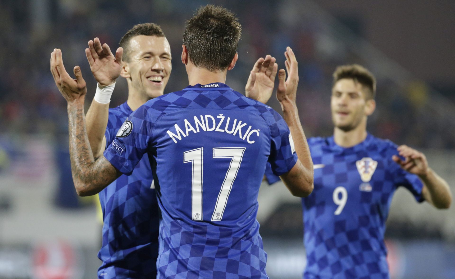 epa05573436 Mario Mandzukic (C) of Croatia celebrate his third goalwith Ivan Perisic during the FIFA World Cup 2018 qualifying soccer match between Kosovo and Croatia in Shkoder, Albania, 06 October 2016.  EPA/ARMANDO BABANI