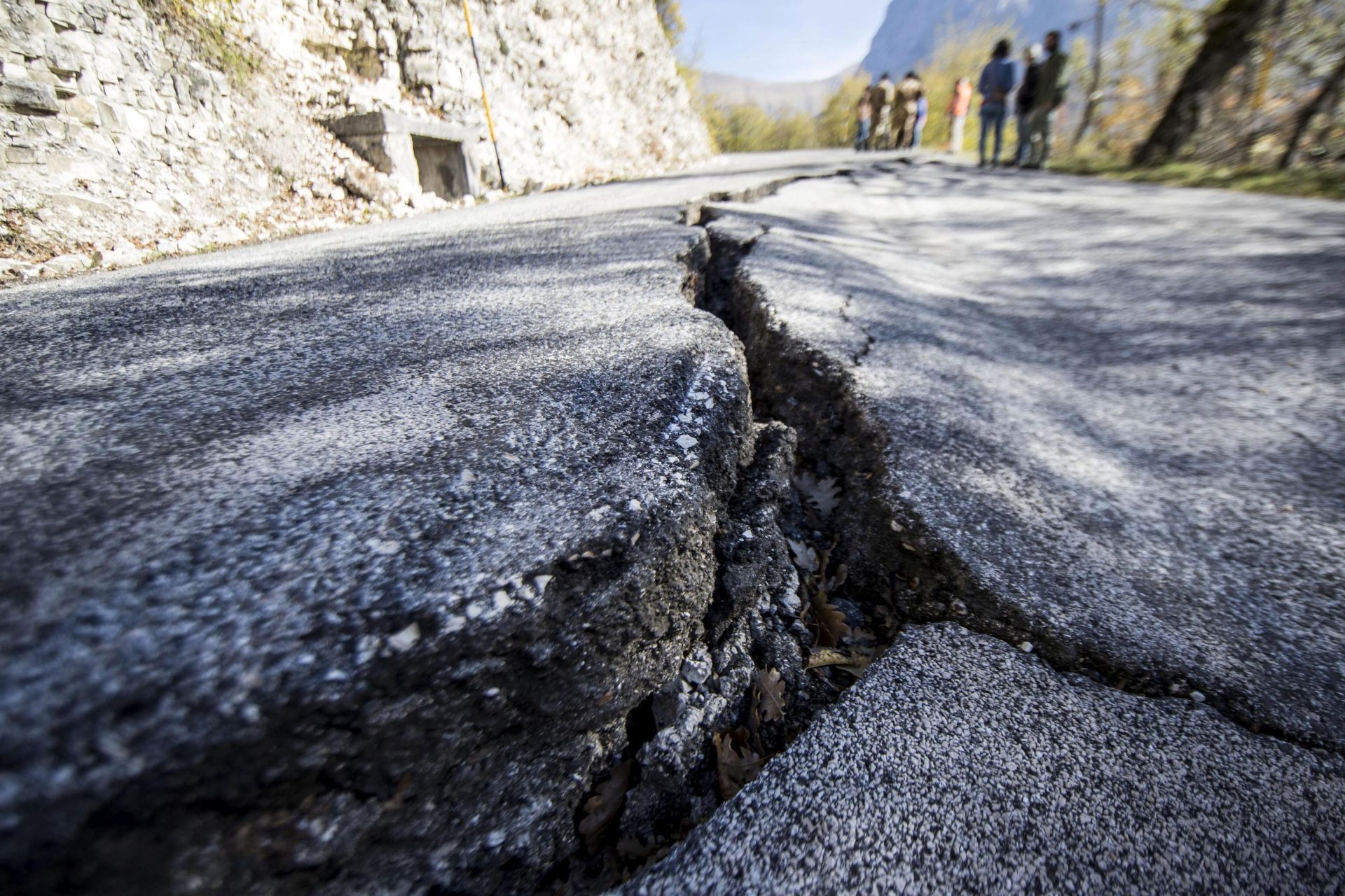 epa05608392 A view of deep rift asphalt road near Ussita, in Macerata province, one of the most affected by the earthquake of three days ago in Central Italy, 29 October 2016. The 5.5 magnitued earthquake destroyed part of the town. Authorities scrambled to find housing for thousands of people displaced by a pair of strong earthquakes that struck the same region of central Italy that was hit by a deadly quake in August.  EPA/MASSIMO PERCOSSI