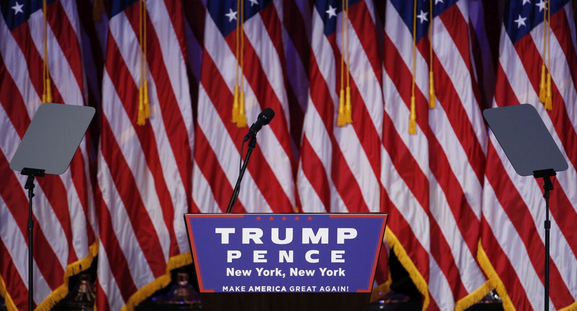 epa05623689 The empty podium at Donald Trump's 2016 US presidential Election Night event as votes continue to be counted at the New York Hilton Midtown in New York, New York, USA, 08 November 2016. Americans vote on Election Day to choose the 45th  President of the United States of America to serve from 2017 through 2020.  EPA/SHAWN THEW