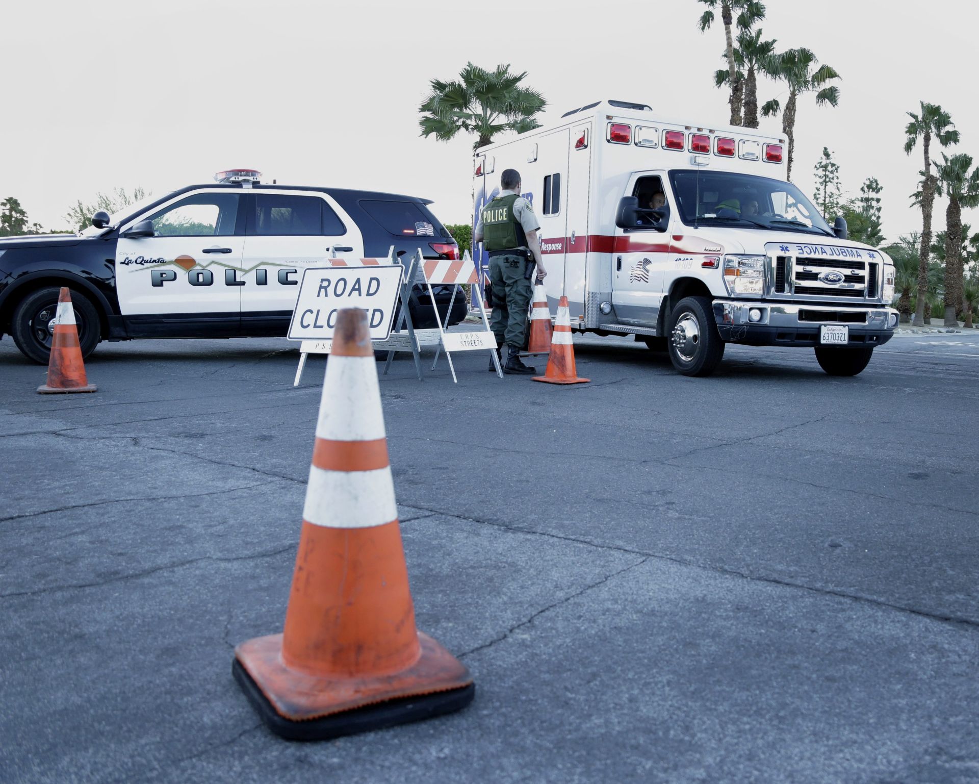 epa05577334 A law enforcement officer allows an ambulance to enter the secured perimeter near the location where two Palm Springs Police Department officers were killed and another was wounded during a domestic disturbance call in Palm Springs, California, USA, 08 October 2016. The two officers, 35-year-veteran Jose Vega and Leslie Zerebny were attempting to make contact with the subject at his residence when he opened fire.  EPA/PAUL BUCK