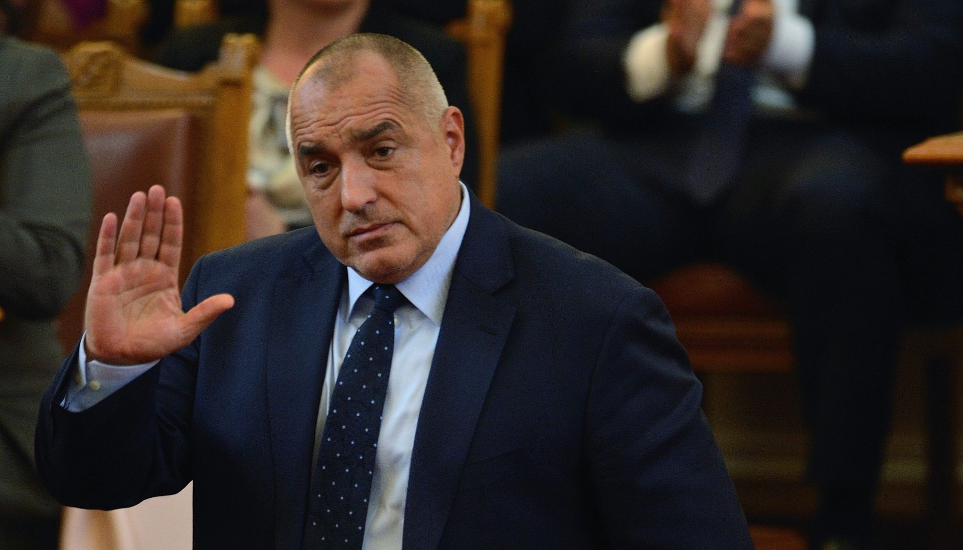 epa05633756 Bulgarian Prime Minister Boyko Borisov waves during the vote on the government's resignation at the Bulgarian Parliament in Sofia, Bulgaria, 16 November 2016. The Prime Minister of Bulgaria, Boiko Borisov, announced the resignation of the Government, after his candidate for President, the current speaker of the Parliament, Tsetska Tsacheva, has lost today's president elections. The winner in the second tour of the presidential elections in Bulgaria is the socialist opposition's candidate, former general Rumen Radev with almost 60 percent of votes.  EPA/VASSIL DONEV