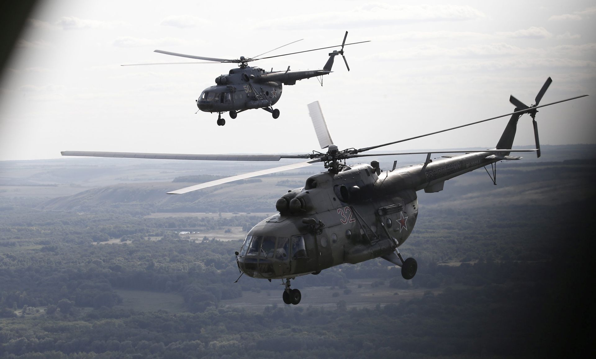 epa04876489 Russian Mi-8 helicopters fly after the 'Masters of armored vehicles' competition during the International Army Games 2015 at the Ostrogorzhsk, Russia, 07 August 2015. Military professionals of armies from Azerbaijan, Angola, Armenia, Belarus, Venezuela, Egypt, India, Kazakhstan, Kyrgyzstan, China, Kuwait, Mongolia, Nicaragua, Pakistan, Russia, Serbia and Tajikistan take part in the International Army Games 2015 held in Russia on ten various grounds from 01 to 15 August 2015 to define the strongest military professionals in 14 disciplines.  EPA/MAXIM SHIPENKOV