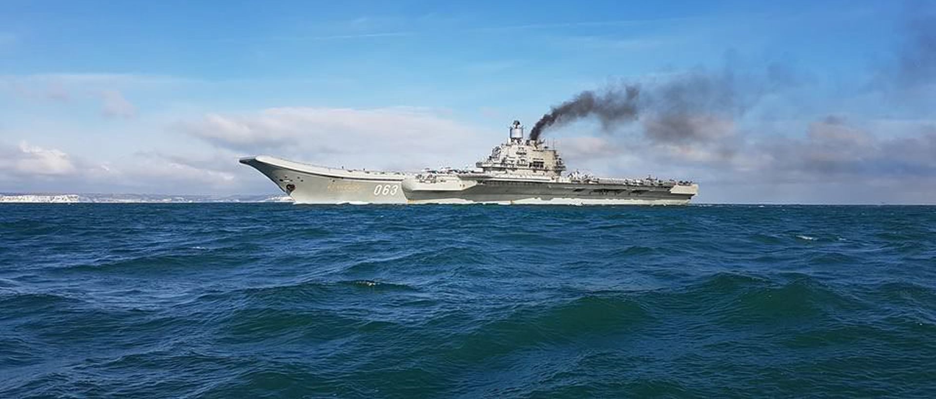 epa05596275 A handout photograph made available by Dover Marina.com on 21 October 2016 showing Russian aircraft carrier Admiral Kuznetsov with the White Cliffs of Dover in the background in the English Channel, 21 October 2016. The Russian Task Group, which includes the sole Russian aircraft carrier, Admiral Kuznetsov, the nuclear powered Kirov Class Battlecruiser, Pyotr Velikiy and two Udaloy Class Destroyers, Vice Admiral Kulakov and Severomorsk sailed from Russia on Saturday 15 October to join the Russian anti-Daesh military operations in Syria.  EPA/DOVER MARINA.COM / HANDOUT MANDTAORY CREDIT: DOVER MARINA.COM HANDOUT EDITORIAL USE ONLY/NO SALES