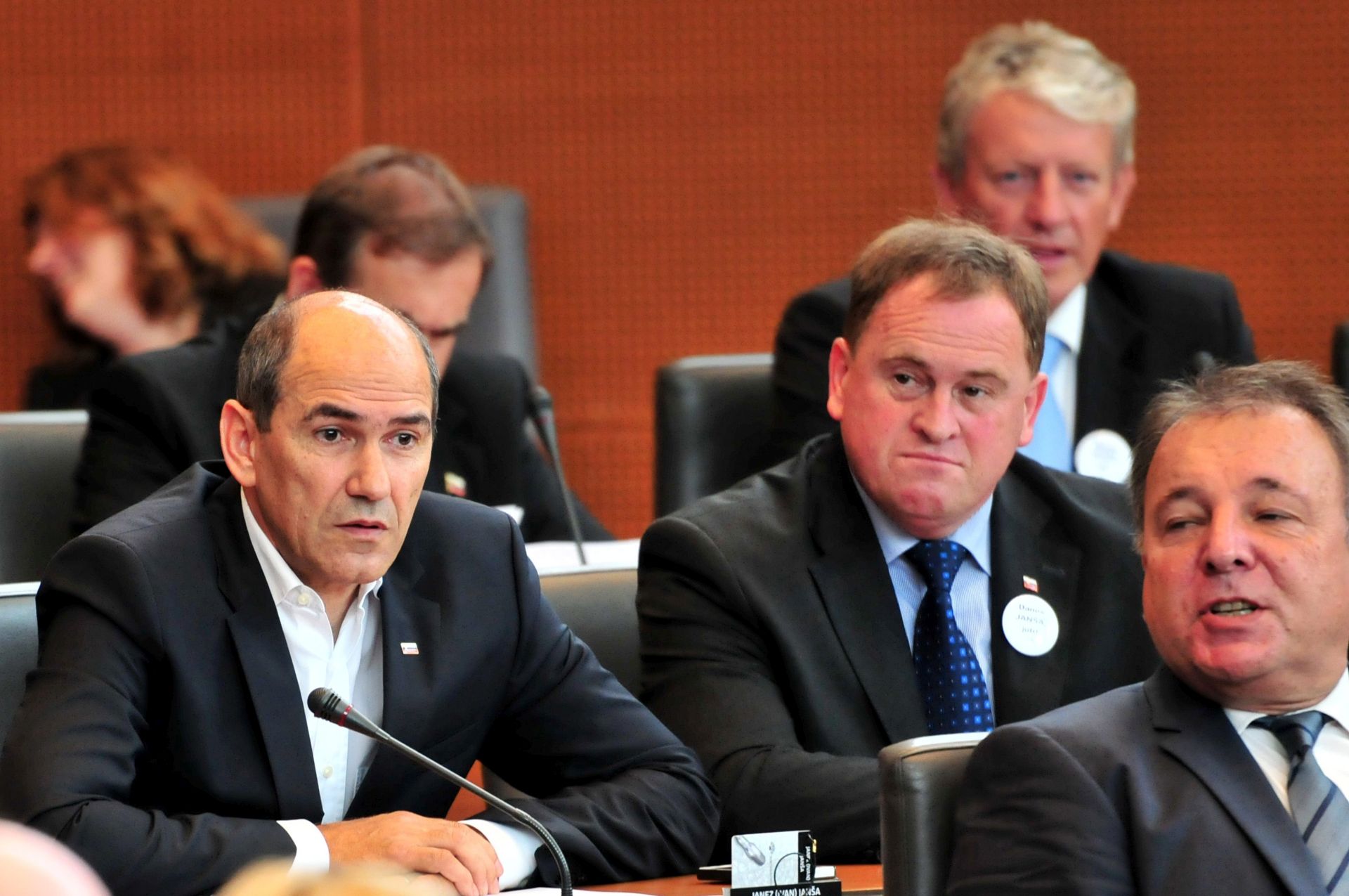 epa04337407 Former Slovenian prime minister and main opposition leader of Slovenian Democratic Union (L) Janez Jansa sits at the Slovenian Parliament in Ljubljana, Slovenia, 01 August 2014. Jansa arrives from the Dob pro Mirni prison where he is currently serving a Two-year jail sentence, to perform his duties as a parliamentarian, as set out in his conviction decisions; Slovenian Constitutional Court convicted Jansa for taking a bribe in the purchase of 135 armoured personnel carriers for the Slovenian army from the Finish company Patria in 2006, but also he can hold his job as a parliamentary member. Jansa will return to his prison enclosures each time he finishes at the parliamentary sessions.  EPA/IGOR KUPLJENIK