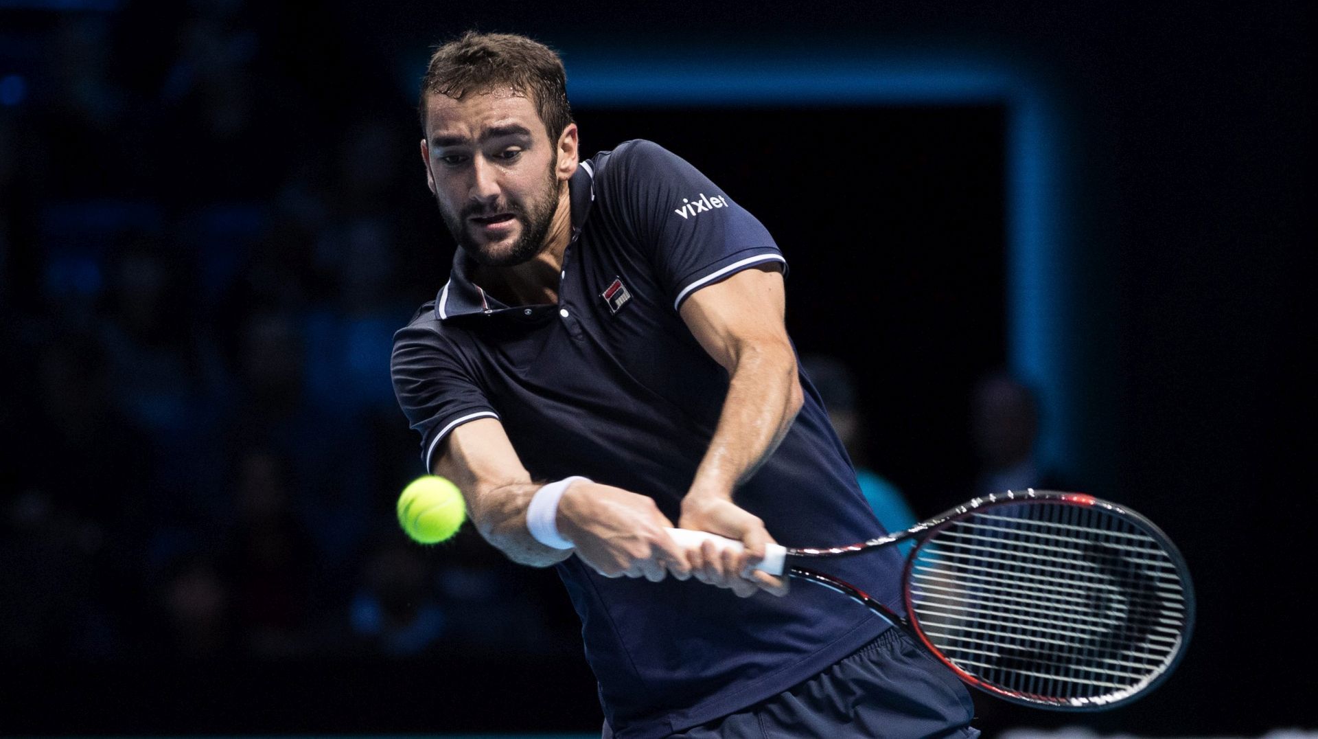 epa05634249 Croatia's Marin Cilic returns the ball to Stan Wawrinka of Switzerland during their singles group stage match at the ATP World Tour Finals tennis tournament at the O2 Arena in London, Britain, 16 November 2016.  EPA/HAYOUNG JEON