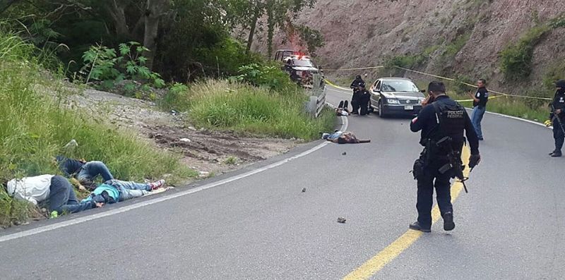 epa05572045 A handout picture provided by Agency Quadratin on 05 October 2016 shows the site where five people were killed during an armed assault on a public bus by unknown gunmen on the road between Chilpancingo and Tuxtla, Mexico, 04 October 2016. Two students of the Normal Rural School of Ayotzinapa died in the attack, the same school were the 43 youths that went missing in Iguala on 26 September 2014 were studying.  EPA/Quadratin / HANDOUT EDITORIAL USE ONLY HANDOUT EDITORIAL USE ONLY