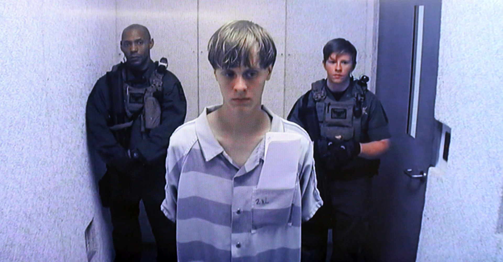 epa05621082 (FILE) A file picture dated 19 June 2015 shows suspect Dylann Roof (C) appears via video link at a bond hearing in court in North Charleston, South Carolina, USA. On 07 November 2016 in Charleston, USA, the final phase for the selection of the jury in Roof's trial has started. Roof is indicted on 33 federal counts of hate crimes, obstruction of religion and using a firearm in a violent crime after he opened fire during a Bible study session at Emanuel African Methodist Episcopal Church in Charleston in June 2015.  EPA/GRACE BEAHM/POOL