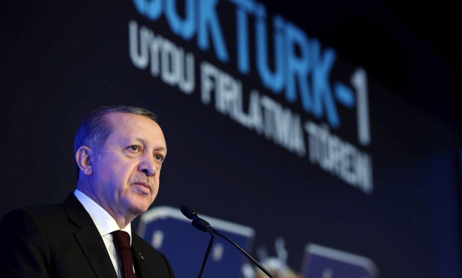 epa05661181 A handout picture provided by Turkish President Press office shows Turkish President Recep Tayyip Erdogan speaks during a ceremony for launching a new Turkish satellite fron French Guiana, at the Turkish Aerospace Industry (TAI) in Ankara, Turkey, 05 December 2016. A Vega rocket with a Turkish satellite Gokturk-1 was launched from Kourou, French Guiana. The 1,060 kilogram weighing satellite will be placed onto an orbit of some 700 kilometers, and will be used to collect high-resolution images for Turkish military and authorities.  EPA/TURKISH PRESIDENT PRESS OFFICE / HANDOUT  HANDOUT EDITORIAL USE ONLY/NO SALES
