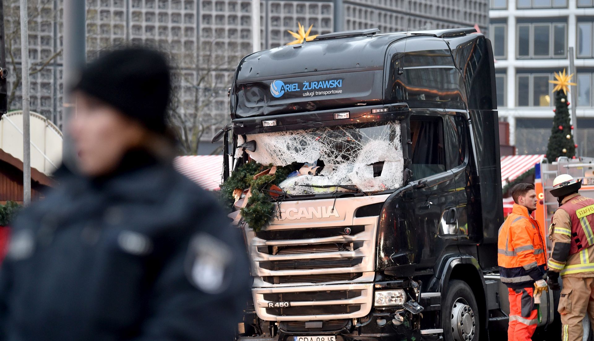 epa05683027 A view of a truck's damaged front windshield, at the scene where the truck crashed into a Christmas market close to the Kaiser Wilhelm Memorial Church, in Berlin, Germany 20 December 2016. According to the police, at least 12 people were killed and at least 48 were injured after a truck ploughed into a busy Christmas market in Berlin. Authorities are investigating the incident as a 'possible terrorist attack,' media reported.  EPA/BRITTA PEDERSEN