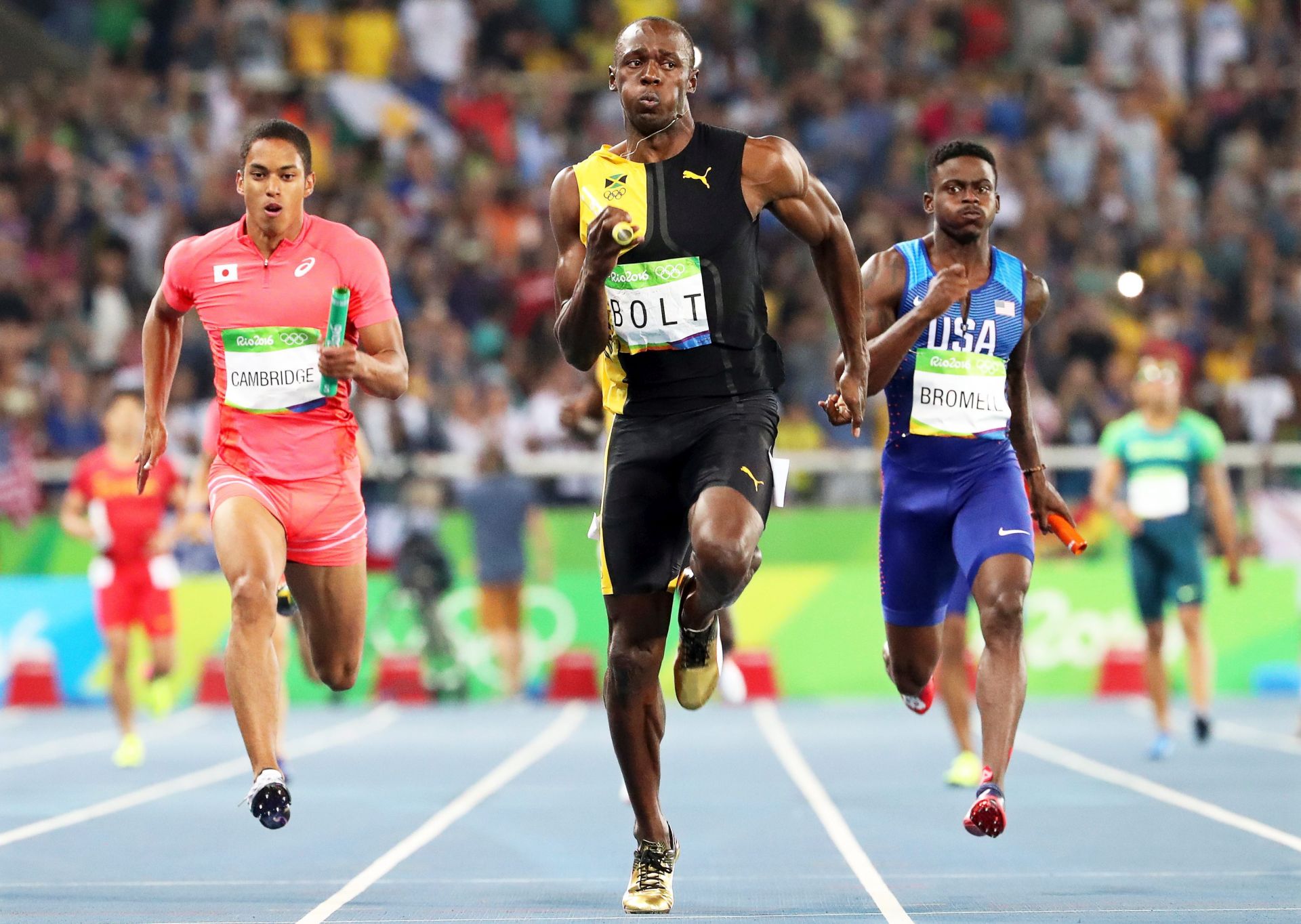 epa05501269 Usain Bolt (C) of Jamaica is on his way to win the men's 4x100m relay final of the Rio 2016 Olympic Games Athletics, Track and Field events at the Olympic Stadium in Rio de Janeiro, Brazil, 19 August 2016. Bolt won ahead of second placed Aska Cambridge (L) of Japan and third placed Trayvon Brommell (R) of the USA.  EPA/SRDJAN SUKI