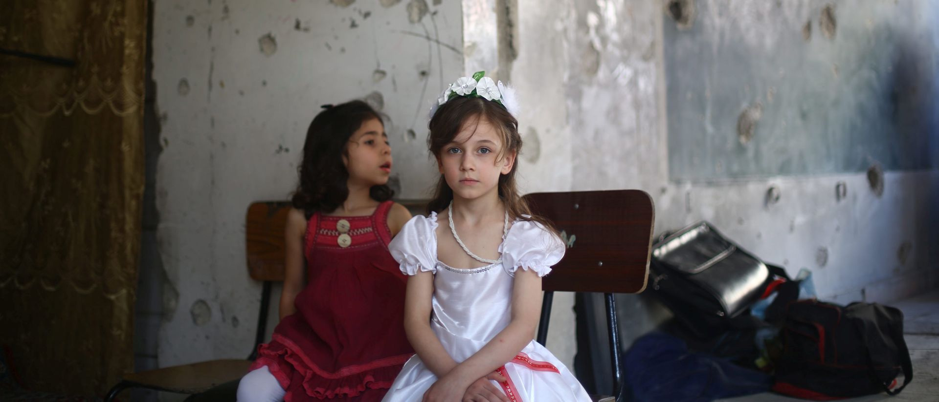 epa05683716 (FILE) A file picture dated 21 May 2016 show girls attending a seminar, Douma, outskirts of Damascus, Syria. The picture won the third prize in the 'UNICEF Photo of the Year 2016' competition, as a jury announced at a ceremony in Berlin, Germany on 20 December 2016.  EPA/MOHAMMED BADRA