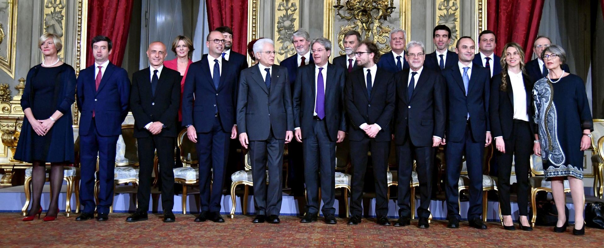 epa05673123 The members of the new cabinet line up for a group photo at Quirinale Palace in Rome, Italy, 12 December 2016. First Row (L-R), Defense Minister Roberta Pinotti, Justice Minister Andrea Orlando, Interior Minister Marco Minniti, Foreign Minister Angelino Alfano, Italian President Sergio Mattarella, Italian Prime Minister Paolo Gentiloni, Sport Minister Luca Lotti, Territorial cohesion Minister Claudio De Vincenti, Regional Affairs Minister Enrico Costa, Public administration Minister Marianna Madia, Relations with Parliament Minister Anna Finocchiaro; Second Row (L-R) Health Minister Beatrice Lorenzin, Cultural heritage Minister Dario Franceschini, Instruction Minister Valeria Fedeli, Labour Minister Giuliano Poletti, Infrastructure Minister Graziano Delrio, Environment Minister Gianluca Galletti, Agriculture Minister Maurizio Martina, Economical progress Minister Carlo Calenda and Economy Minister Pier Carlo Padoan. President Mattarella on 11 December gave the former foreign minister a mandate to form a new government in the wake of Matteo Renzi's resignation as premier last week, following a crushing defeat in a 04 December constitutional referendum.  EPA/ETTORE FERRARI
