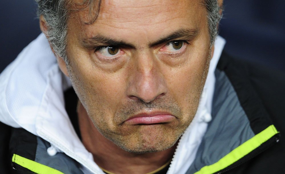 Real Madrid's coach Jose Mourinho, from Portugal, reacts during a quarterfinal, second leg, Copa del Rey soccer match against FC Barcelona at the Camp Nou stadium, in Barcelona, Spain, Wednesday, Jan. 25, 2012. (AP Photo/Manu Fernandez)