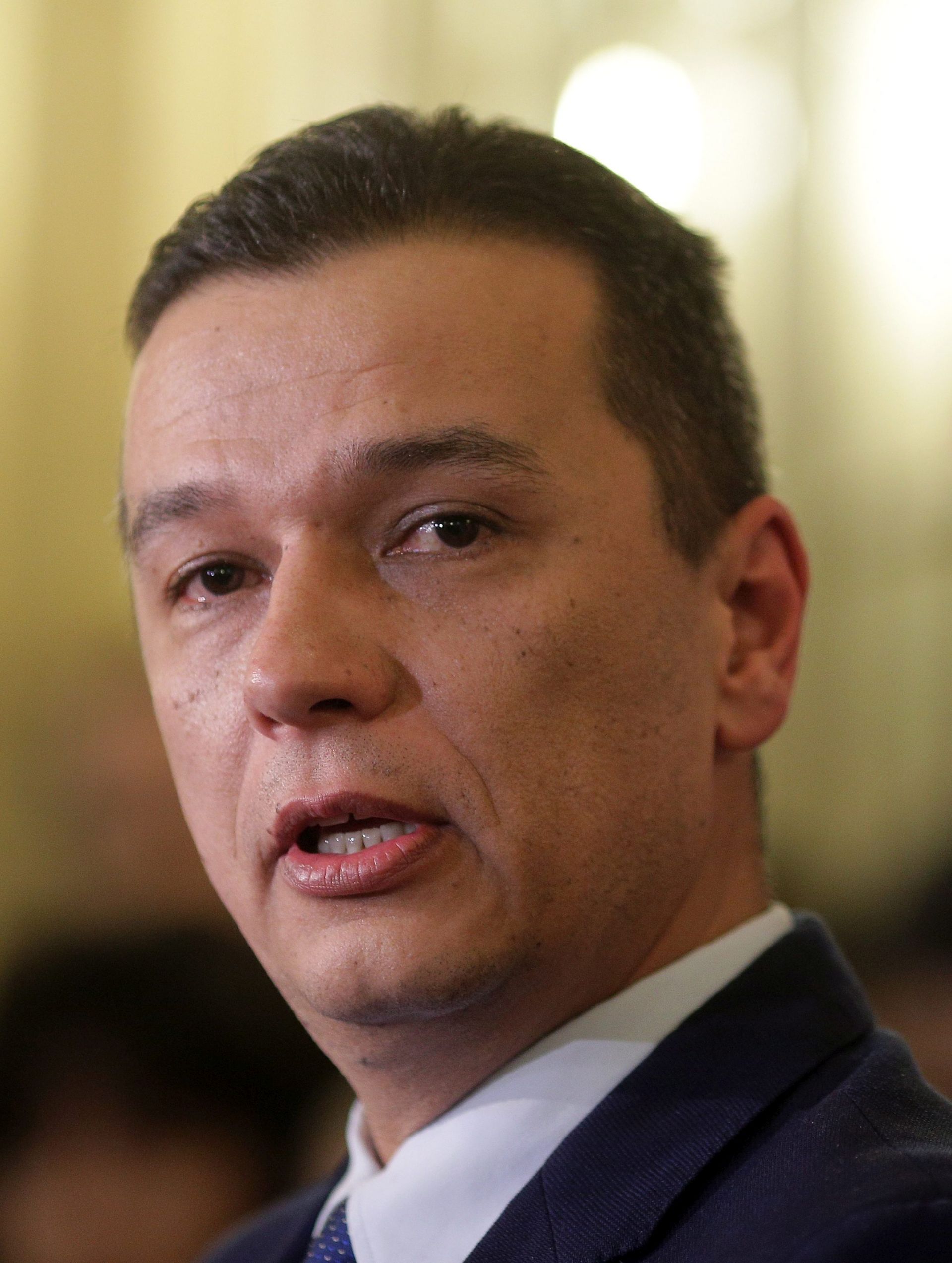 epa05690399 Former telecommunications minister Sorin Grindeanu looks on during a news conference at Social Democratic Party (PSD) headquarters in Bucharest, Romania, 28 December 2016. Grindeanu is PSD's new proposal as the next prime minister after the president turned down the party's first choice. PSD party won the parliamentary elections held on 11 December, and together with ALDE (The Alliance of Liberals and Democrats in Romania) has the majority in Romanian parliament.  EPA/Octav Ganea