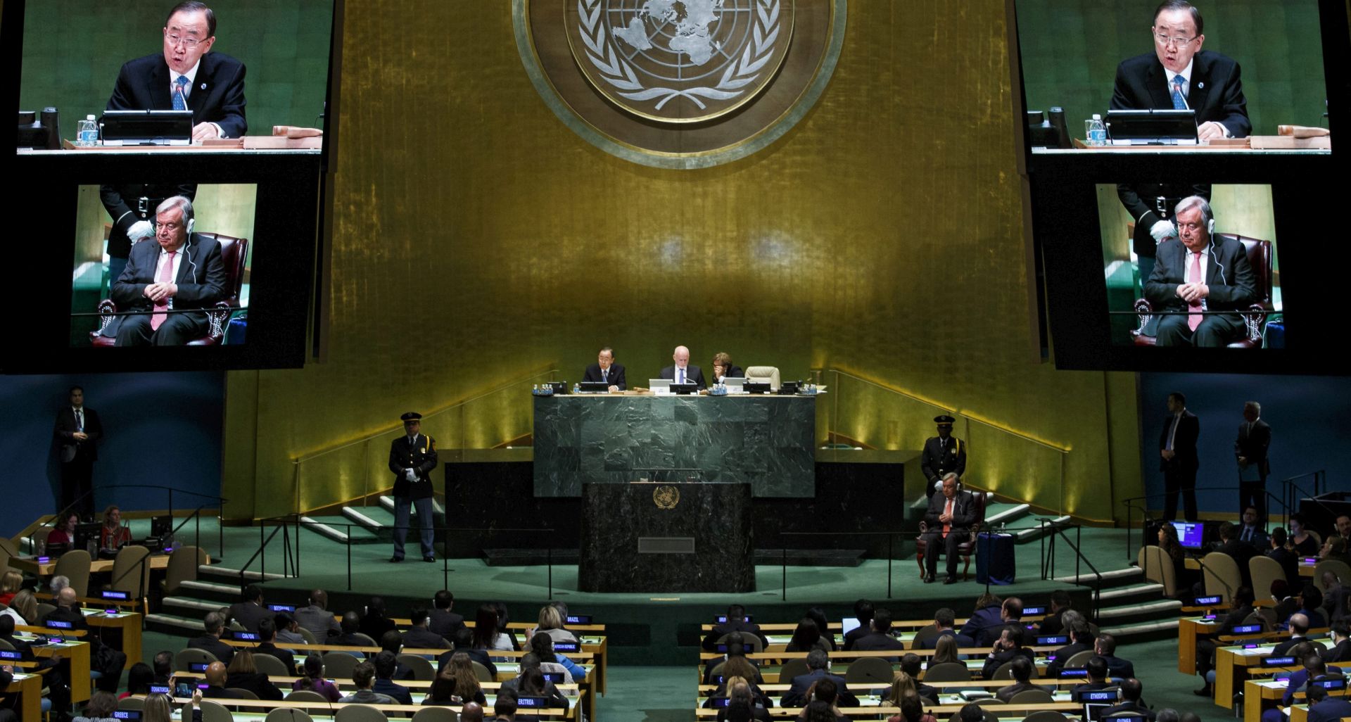 epa05583839 Antonio Guterres (bottom), the Secretary-General designate of the United Nations, listens as United Nations Secretary-General Ban Ki-moon speaks after Guterres was approved by the General Assembly hall at United Nations headquarters in New York, New York, USA, 13 October 2016. Guterres will officially take the position as UN Secretary General in January of 2017.  EPA/JUSTIN LANE