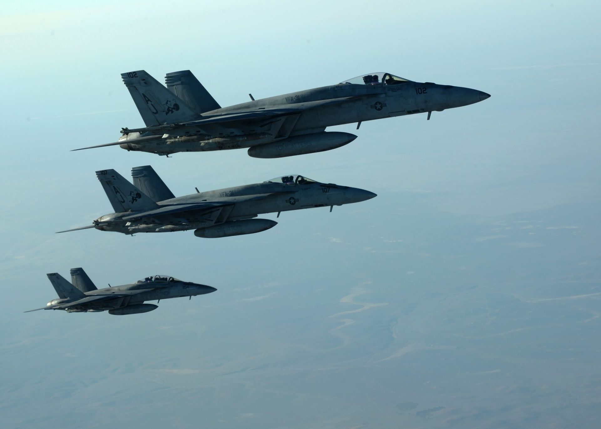epa04416226 A handout picture made available by the US Department of Defense (DoD) on 25 September 2014 shows a formation of US Navy F-18E Super Hornets leaving after receiving fuel from a KC-135 Stratotanker over northern Iraq, 23 September 2014. These aircraft were part of a large coalition strike package that was the first to strike Islamic State (IS or ISIL) targets in Syria. Airstrikes carried out on late 24 September 2014 against Islamic State targets in Syria hit oil refineries that the US says provide a revenue stream for the militants, the Pentagon says. The oil refineries provide about 2 million US dollar a day in revenue for the Islamic State, Rear Admiral John Kirby says. Kirby spoke after the raids ended and all aircraft returned safely. The United States was joined by Saudi Arabia and the United Arab Emirites in carrying out the strikes, Kirby says.  EPA/DOD/US AIR FORCE/SGT. SHAWN NICKEL  HANDOUT EDITORIAL USE ONLY