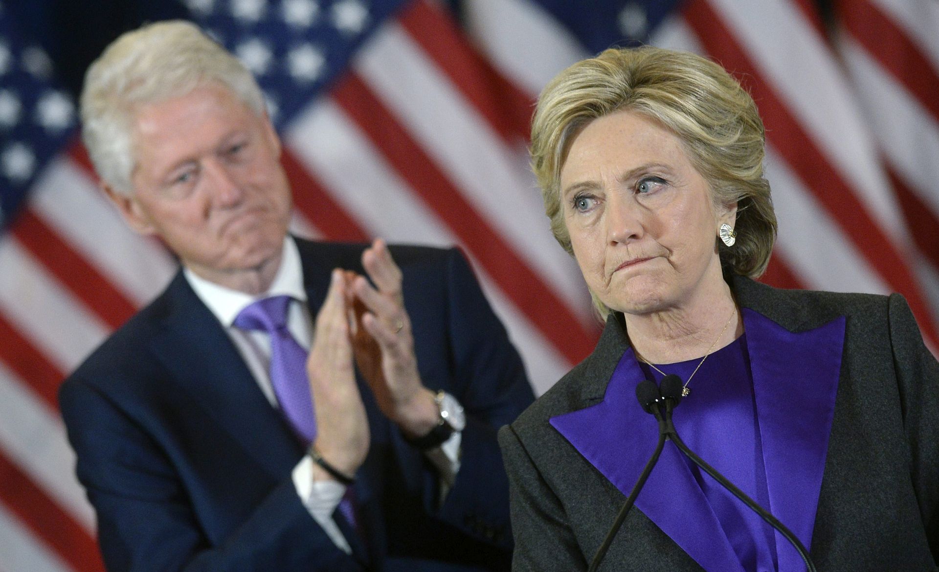 epa05624567 Democractic presidential candidate Hillary Clinton (R) delivers her concession speech next to her husband former US president Bill Clinton (L), at the New Yorker Hotel's Grand Ballroom in New York city , New York, USA, 09 November 2016. Republican President-elect Donald Trump will become the 45th President of the United States of America to serve from 2017 through 2020.  EPA/OLIVIER DOULIERY / POOL