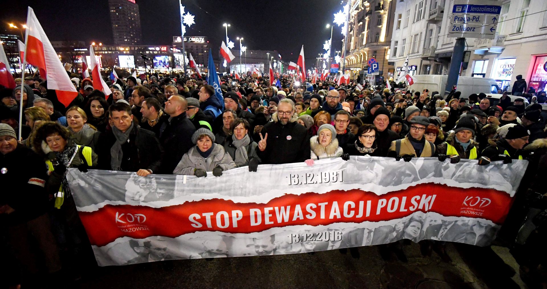 epa05674271 Former Polish PM Ewa Kopacz (4-R), the Committee for the Defence of Democracy (KOD) leader Mateusz Kijowski (6-R) and leader of Polish Nowoczesna Party Ryszard Petru (3-L) with other demonstrators take part in the 'Stop Devastation of Poland' march organized by the Committee for the Defence of Democracy (KOD) on the 35th anniversary of the introduction of martial law in Poland, in Warsaw, Poland, 13 December 2016. The march is organized to protest against the Polish government of Law and Justice party (PiS). The symbolic date of the 13th of December relates to the introduction of the martial law in Poland in 1981. As the organizers say: the fight to preserve the democratic state of law is a tribute to the victims of the martial law.  EPA/BARTLOMIEJ ZBOROWSKI POLAND OUT