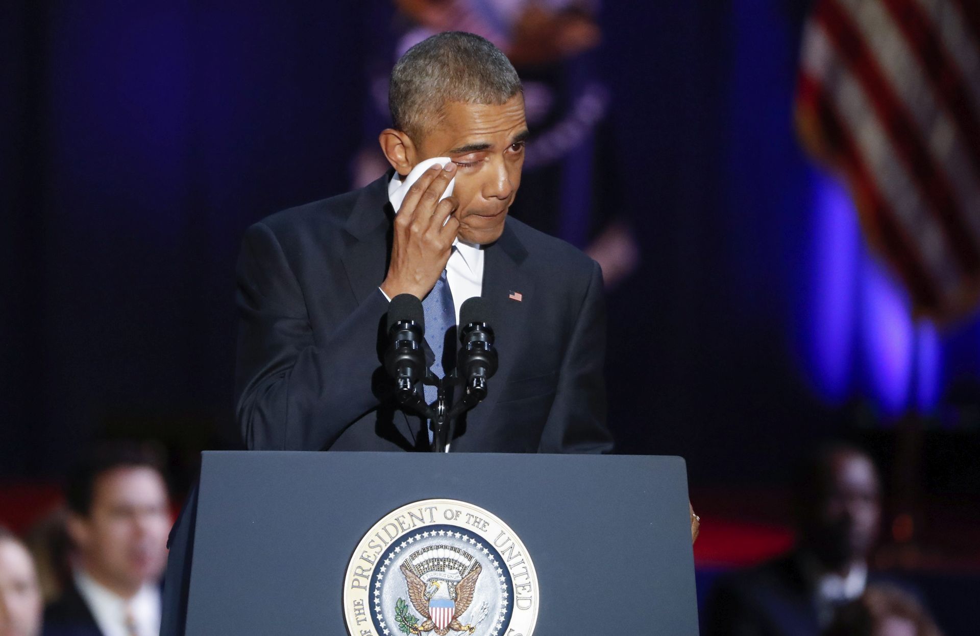 epaselect epa05710202 US President Barack Obama wipes a tear from his eye while delivering his farewell address to the American people at McCormick Place in Chicago, Illinois, USA, 10 January 2017. Obama's eight year term as president of the USA ends on 20 January when President-elect Donald Trump takes the oath of office.  EPA/KAMIL KRZACZYNSKI