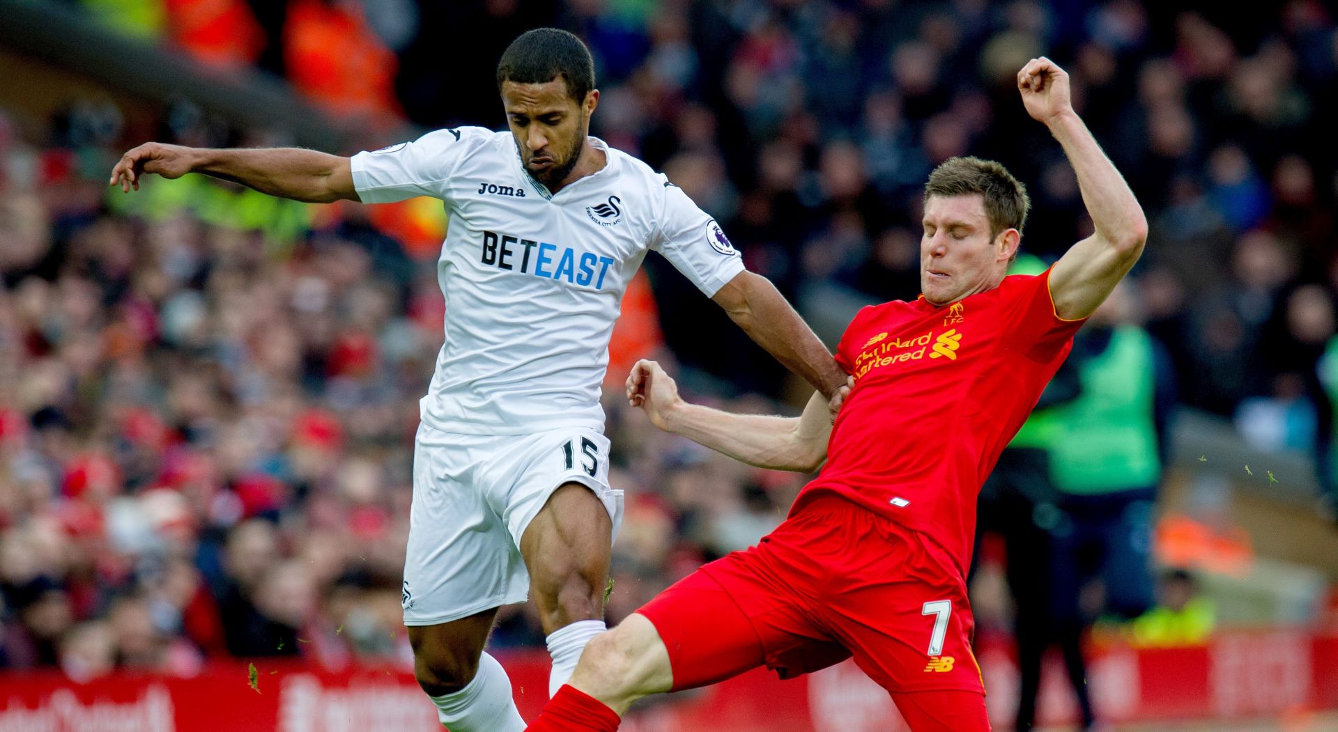 epa05738369 Swansea's Wayne Routledge (L) in action with Liverpool’s James Milner (R) during the English Premier League soccer match between Liverpool and Swansea City held at Anfield, Liverpool, Britain, 21 January 2017.  EPA/PETER POWELL EDITORIAL USE ONLY. No use with unauthorized audio, video, data, fixture lists, club/league logos or 'live' services. Online in-match use limited to 75 images, no video emulation. No use in betting, games or single club/league/player publications