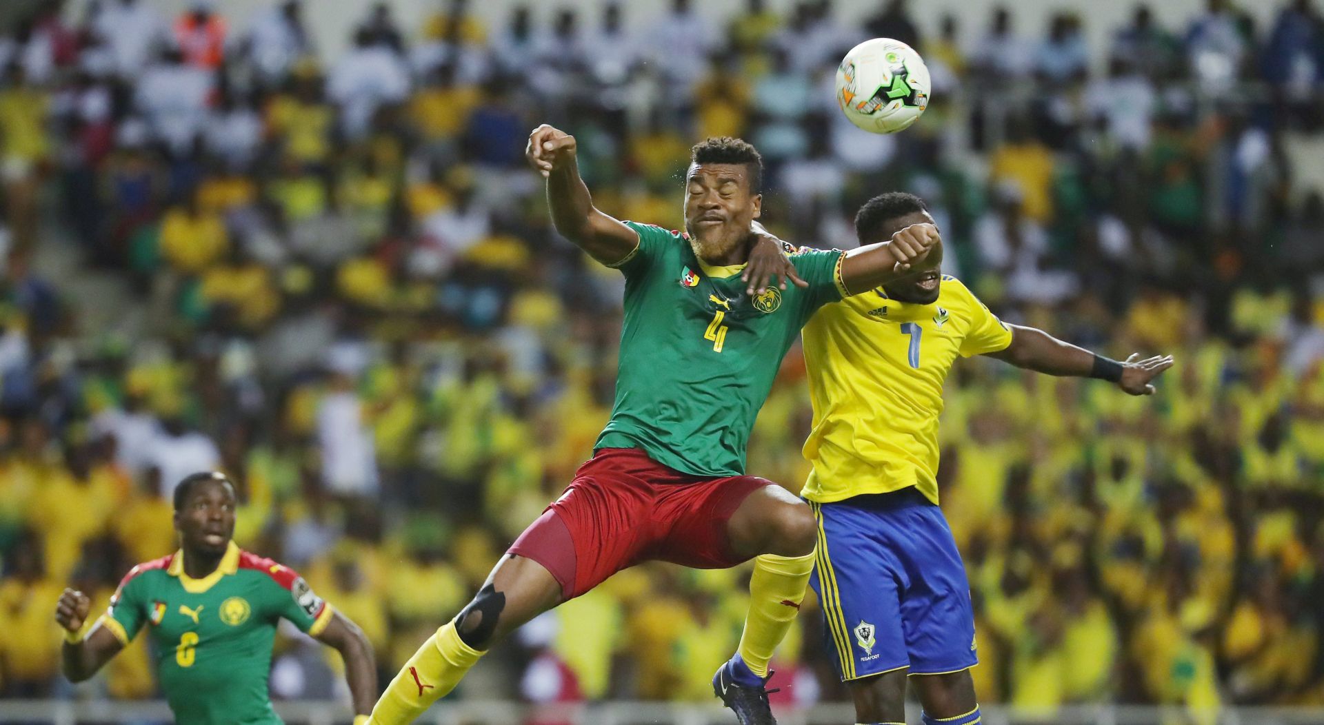 epa05742415 Adolph Teikeu Kamgang of Cameroon (l) wins header against Evouna Malick of Gabon during the 2017 African Cup of Nations Finals Afcon football match between Cameroon and Gabon at the Libreville Stadium in Gabon on 22 January 2017.  EPA/Gavin Barker This image is intended for Editorial use (e.g. news articles). Any commercial use (e.g. ad campaigns) requires additional clearance. Contact: photo@backpagemedia.co.za for more information