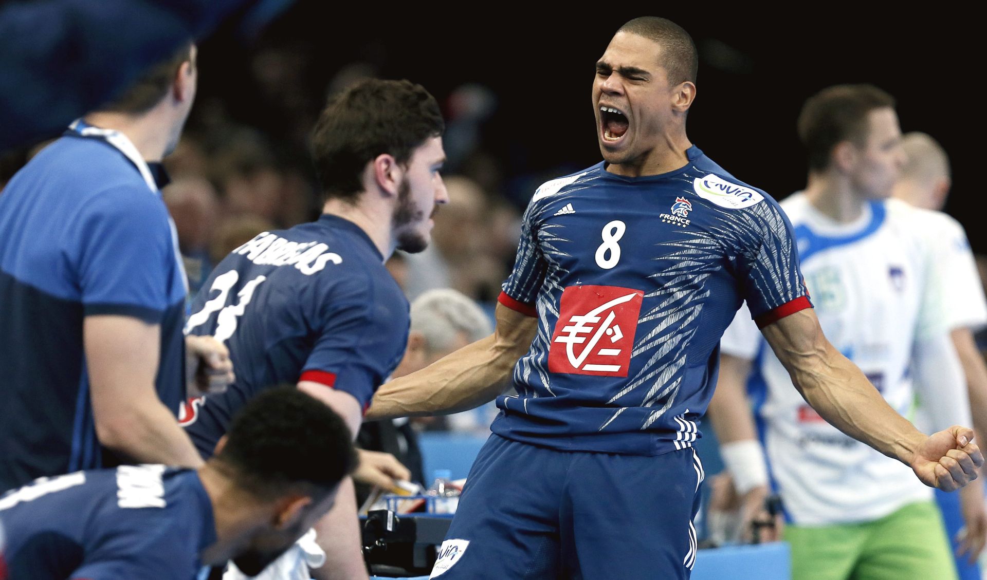epa05753060 Daniel Narcisse (R) of France reacts during the semi-final match between France and Slovenia at the IHF Men's Handball World Championship, Paris, France, 26 January 2017.  EPA/ETIENNE LAURENT