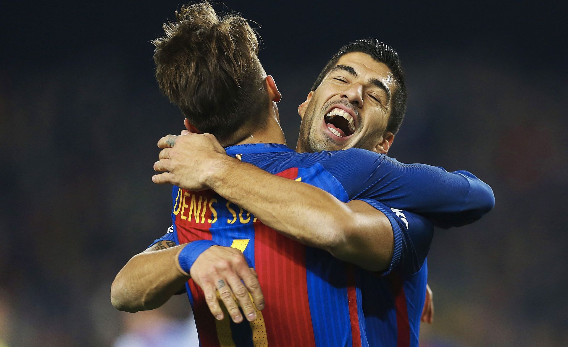 epa05753077 FC Barcelona's midfielder Denis Suarez (L) celebrates with his team mate, Uruaguayan striker Luis Suarez (R) his goal against Real Sociedad during their King's Cup quarter finals second leg match played at Camp Nou stadium in Barcelona, Catalonia, Spain on 26 Janaury 2017.  EPA/ALEJANDRO GARCIA