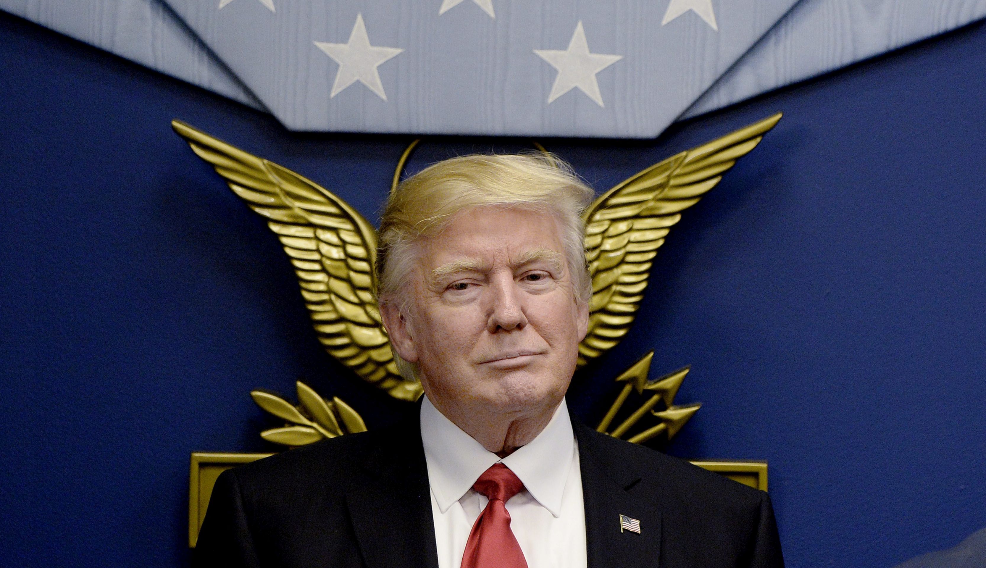 epa05755632 US President Donald Trump looks on before signing Executive Orders in the Hall of Heroes at the Pentagon in Arlington, Virginia, USA, 27 January 2017.  EPA/OLIVIER DOULIERY / POOL