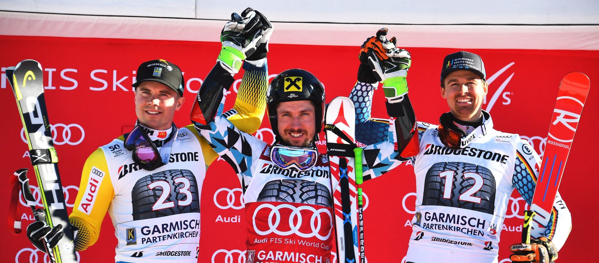 epa05759233 Marcel Hirscher (C) of Austria celebrates on the podium after winning the men's Giant Slalom race at the FIS Alpine Skiing World Cup in Garmisch-Partenkirchen, Germany, 29 January 2017. Hirscher won ahead of second placed Matts Olsson (L) of Sweden and third placed Stefan Luitz (R) of Germany.  EPA/CHRISTIAN BRUNA