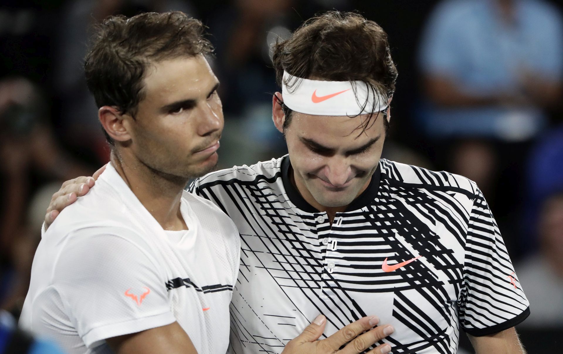 epa05759234 Roger Federer (R) of Switzerland is congratulated by Rafael Nadal (L) of Spain after winning their Men's Singles final match at the Australian Open Grand Slam tennis tournament in Melbourne, Victoria, Australia, 29 January 2017.  EPA/MARK R. CRISTINO