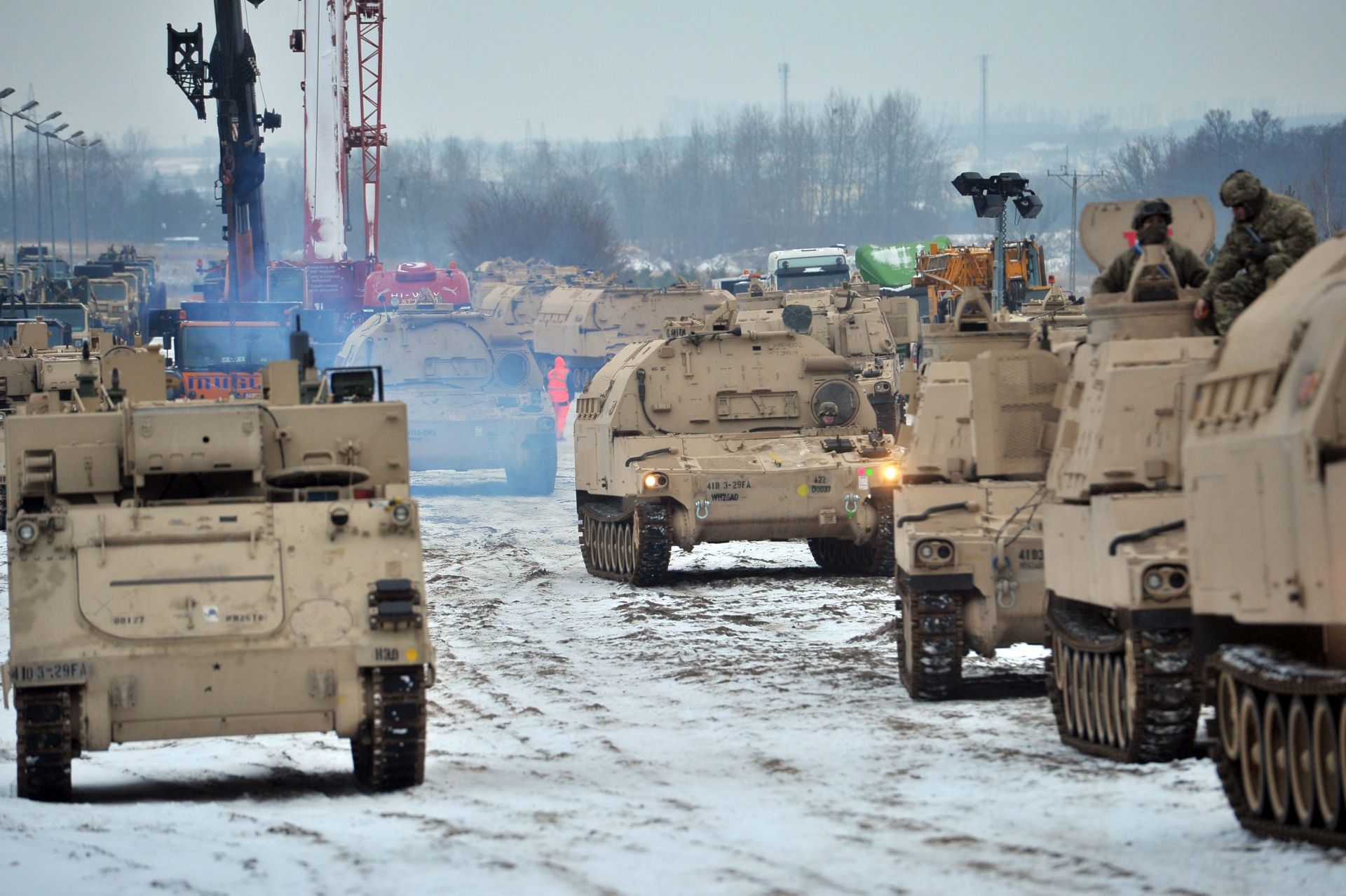 epa05708854 Military equipment from the U.S. 3rd Armored Brigade Combat Team, 4th Infantry Division is unloaded in Camp Drawsko Pomorskie, Poland, 10 January 2017. US soldiers arrived in Poland as part of an effort to reinforce NATO's eastern flank. The American armoured brigade - the 3rd Armored Brigade Combat Team, part of the 4th Infantry Division - from Fort Carson, Colorado, is to be deployed to Poland as well as the Baltic states and Romania.  EPA/MARCIN BIELECKI POLAND OUT