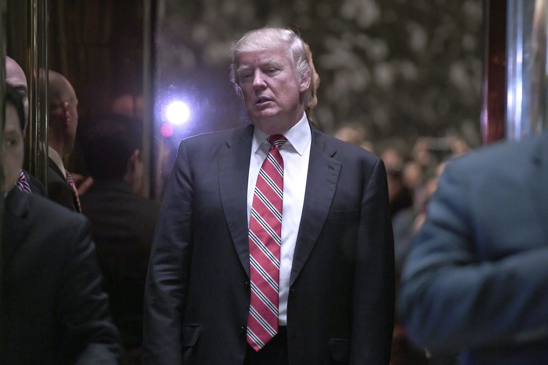 epa05722251 US President-elect Donald Trump stands inside the lobby elevator after meeting with Martin Luther King III (not pictured) at Trump Tower in New York, USA, 16 January 2017. The US government commemorates Martin Luther King Jr. on a federal holiday, what would have been the slain civil rights leader's 88th birthday. US President-elect Donald Trump will be sworn in as the US President 20 January 2017.  EPA/ANTHONY BEHAR / SIPA USA POOL