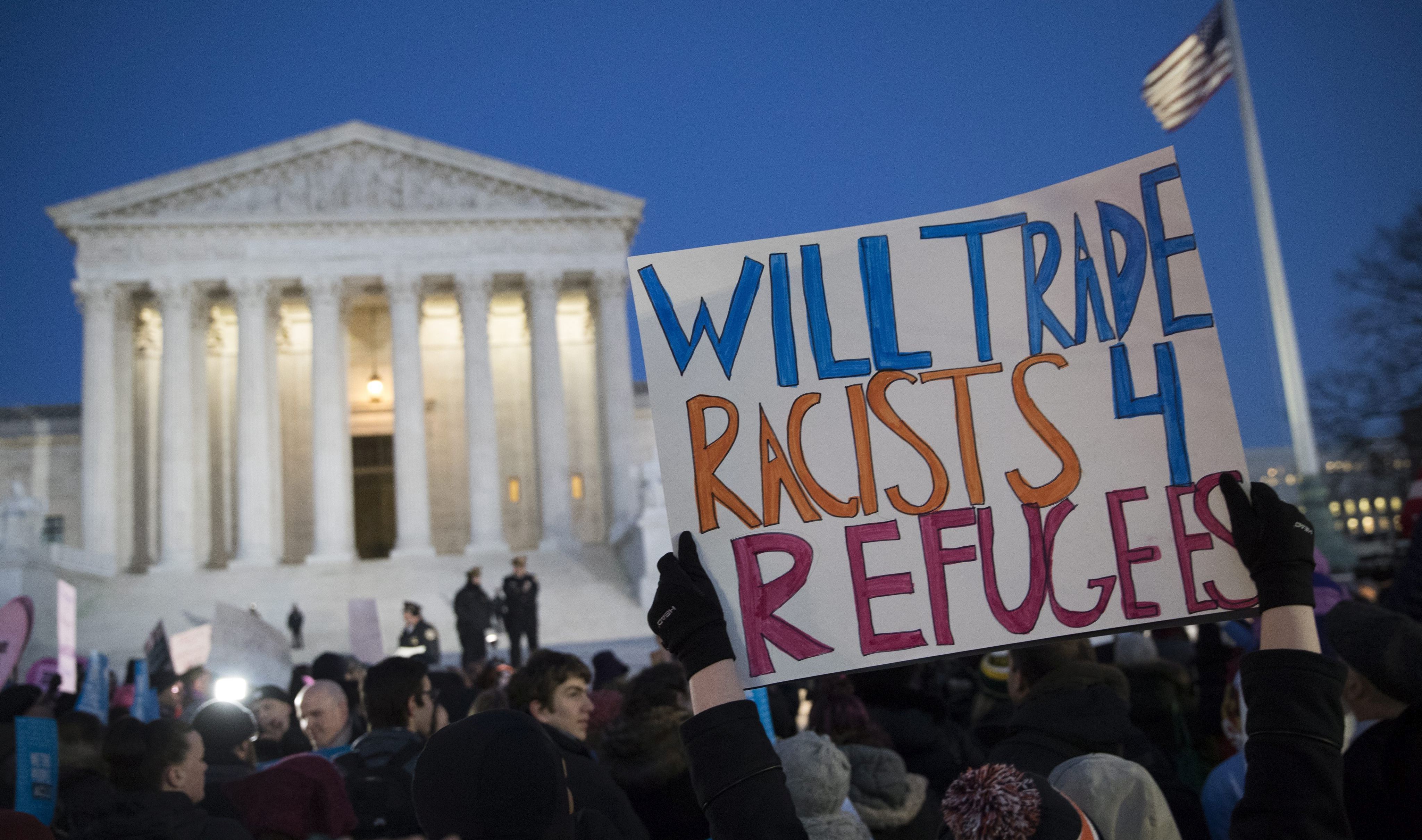 epa05762058 Protesters join Senate and House Democrats during a rally to oppose US President Donald J. Trump's immigration ban in front of the Supreme Court in Washington, DC, USA, 30 January 2017.  EPA/SHAWN THEW
