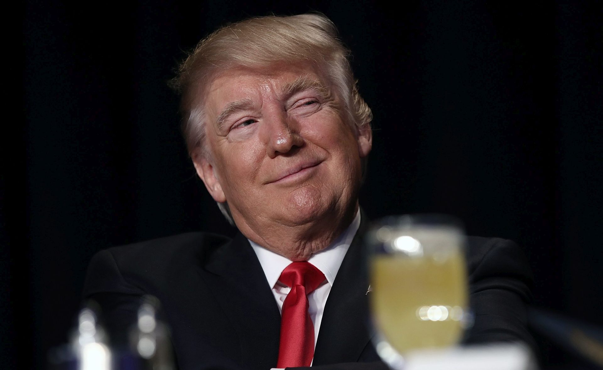 epa05766811 U.S. President Donald J. Trump listens as television producer Mark Burnett introduces him at the National Prayer Breakfast in Washington, DC., USA, 02 February 2017. Every U.S. president since Dwight Eisenhower has addressed the annual event.  EPA/WIN MCNAMEE / GETTY IMAGES / POOL AFP OUT