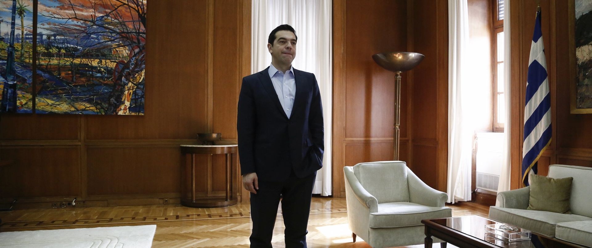 epa05782464 Greek Prime Minister Alexis Tsipras stand prior to a meeting at his office at the parliament in Athens, Greece, 10 February 2017. Eurozone lenders and the International Monetary Fund have reached an agreement between themselves on a common stance they will present to Greece, a senior eurozone official said.  EPA/YANNIS KOLESIDIS