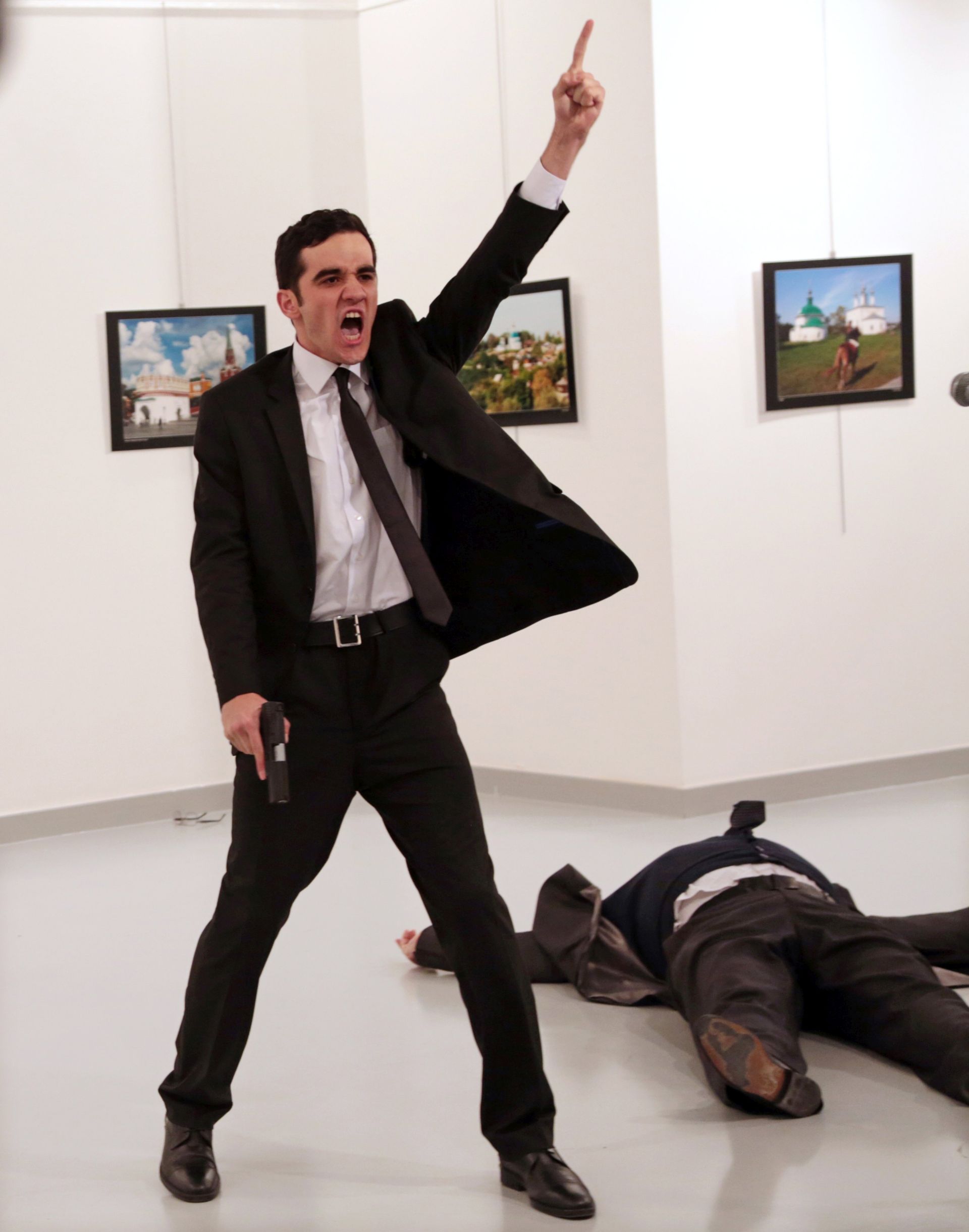 epa05790482 A handout photo made available by the World Press Photo (WPP) organization on 13 February 2017 shows a picture by The Associated Press photographer Burhan Ozbilici that won the Spot News - First Prize, Stories award of the 60th annual World Press Photo Contest, it was announced by the WPP Foundation in Amsterdam, The Netherlands on 13 February 2017.

Spot News - First Prize, Stories

© Burhan Ozbilici, The Associated Press 
Title: An Assassination in Turkey

Photo caption:
Mevlut Mert Altintas shouts after shooting Andrey Karlov, the Russian ambassador to Turkey, at an art gallery in Ankara, Turkey.

Story: 
Mevlut Mert Altintas, a 22-year-old off-duty police officer, assassinated the Russian ambassador to Turkey, Andrey Karlov, at an art exhibition in Ankara, Turkey, on 19 December 2016. He wounded three other people before being killed by officers in a shootout.

TURKEY OUT TURKISH AUTHORITIES HAVE IMPOSED A BLACKOUT ON THE DISTRIBUTION INSIDE TURKEY OF ANY MATERIAL CONCERNING THE SHOOTING IN ANKARA. THIS AFFECTS ALL PHOTO AND VIDEO BEING SENT BACK INTO TURKEY  EPA/Burhan Ozbilici/The Associated Press/WORLD PRESS PHOTO HANDOUT ATTENTION EDITORS : EDITORIAL USE ONLY / NO SALES / NO ARCHIVE / NO CROPPING / NO MANIPULATING / USE ONLY FOR SINGLE PUBLICATION IN CONNECTION WITH THE WORLD PRESS PHOTO AND ITS ACTIVITIES HANDOUT EDITORIAL USE ONLY/NO SALES/NO ARCHIVES HANDOUT EDITORIAL USE ONLY/NO SALES/NO ARCHIVES