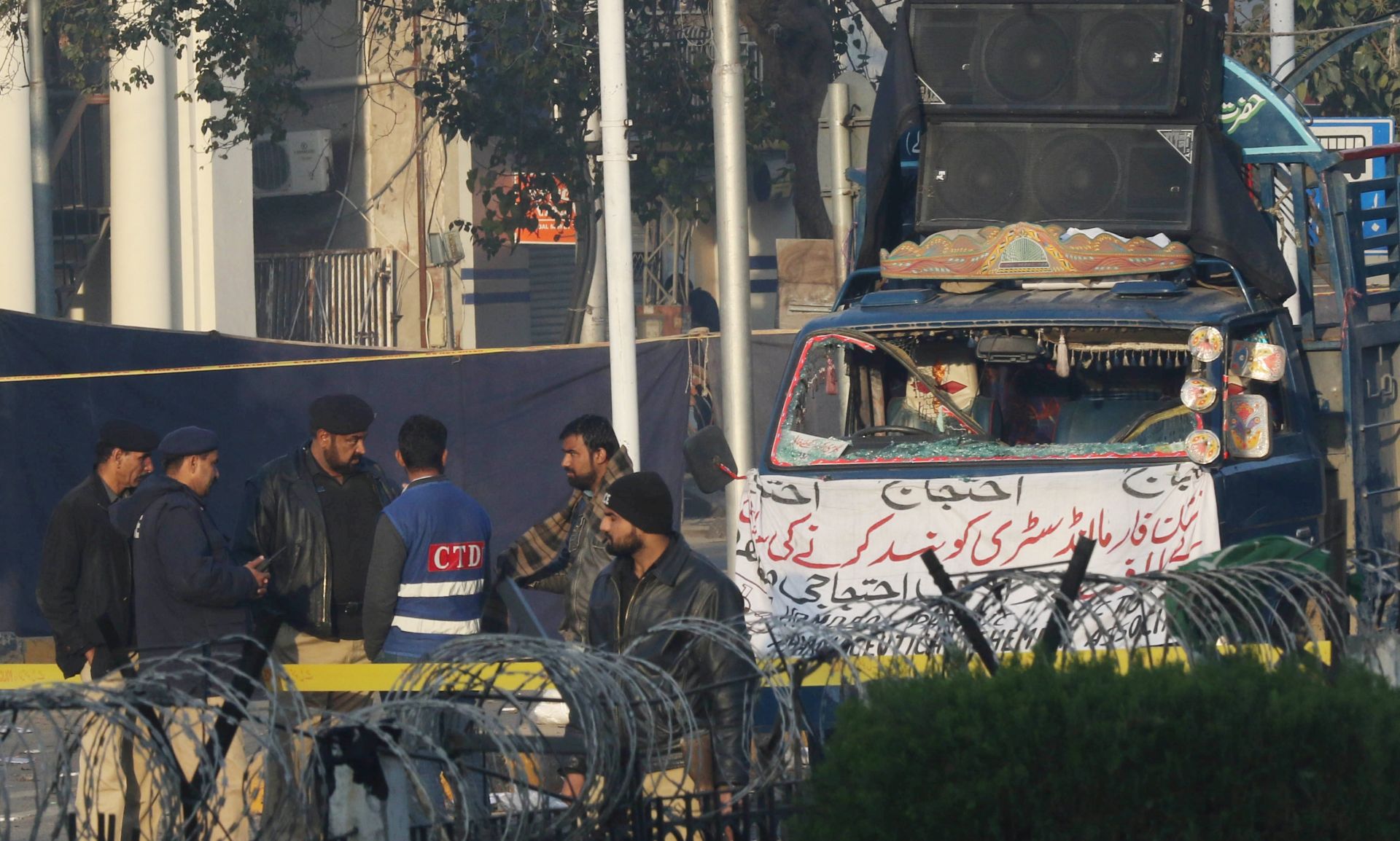 epa05791939 Pakistani security officials inspect the scene a day after a suicide bomb blast in Lahore, Pakistan 14 February 2017. At least 13 people, including two senior police officials, were killed and several others injured when a suicide attacker detonated his explosive vest during a rally held by hundreds of pharmacists. A faction of the Pakistani Taliban, Jamaat-ul-Ahrar, claimed responsibility for the bombing.  EPA/RAHAT DAR