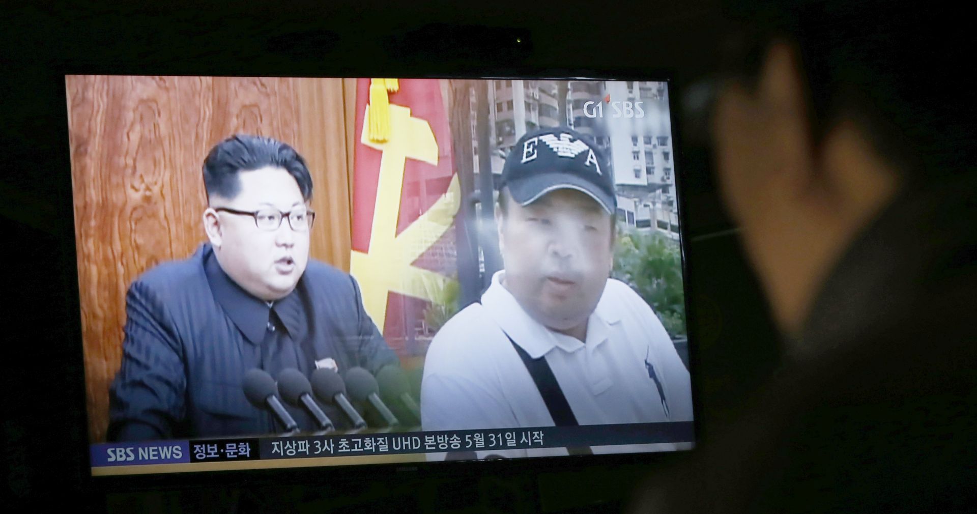 epa05795208 A South Korean watches TV showing breaking news about the alleged assassination of North Korean leader Kim Jong-un's half-brother, at a restaurand in Pyeongchang, Gangwon-do, South Korea, 15 February 2017. According to South Korean media reports on 14 February 2017, Kim Jong-nam, the half-brother of North Korean leader Kim Jong-un, has apparently been assassinated by unknown persons at the Kuala Lumpur airport. He reportedly immigrated to China in 1995, and has since then lived there under Chinese protection.  EPA/JEON HEON-KYUN