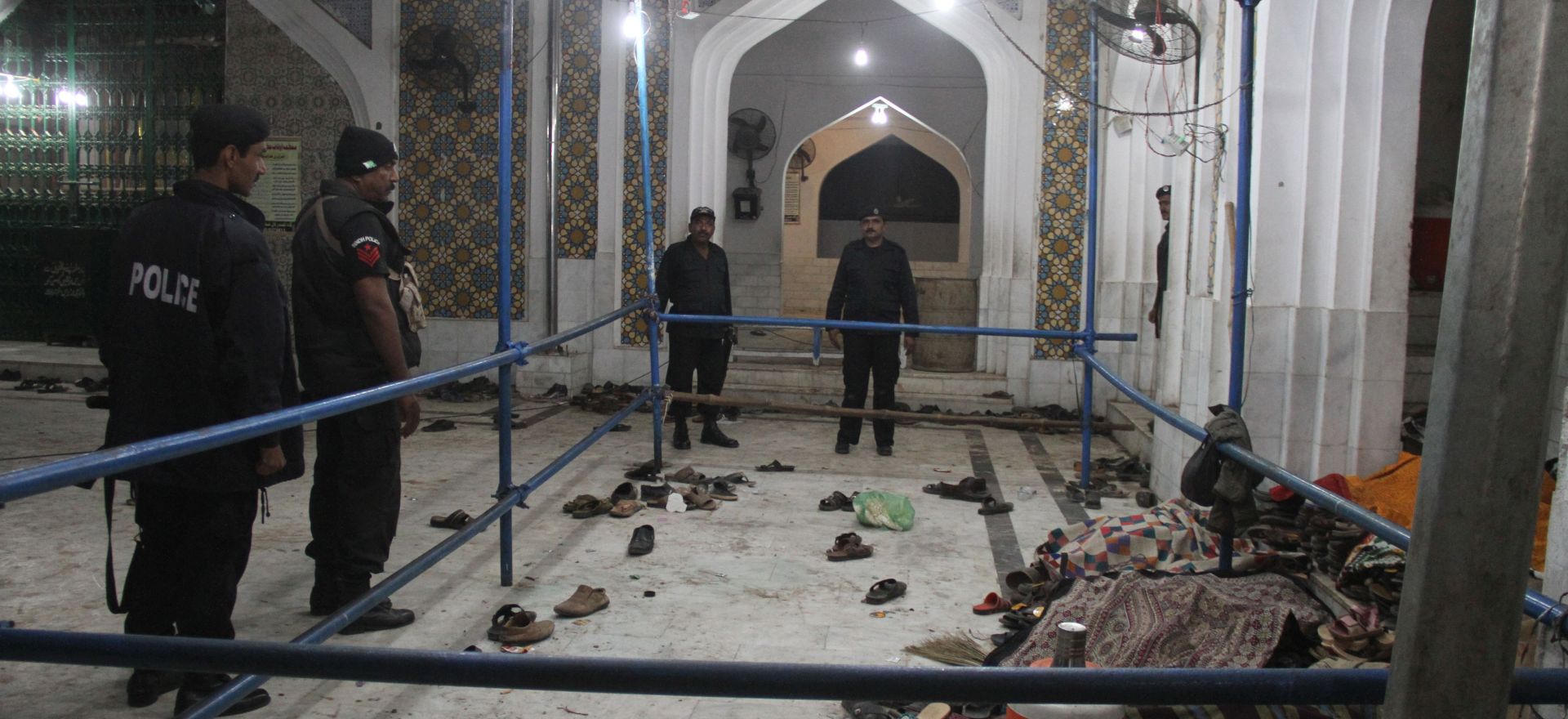 epa05797845 Security officials secure the shrine of Sufi Muslim saint Lal Shahbaz Qalandar, after a suicide bomb attack, at Sehwan, Pakistan, 16 February 2017. At least 70 people were killed and more than 250 injured in the incident.  EPA/NADEEM KHAWER