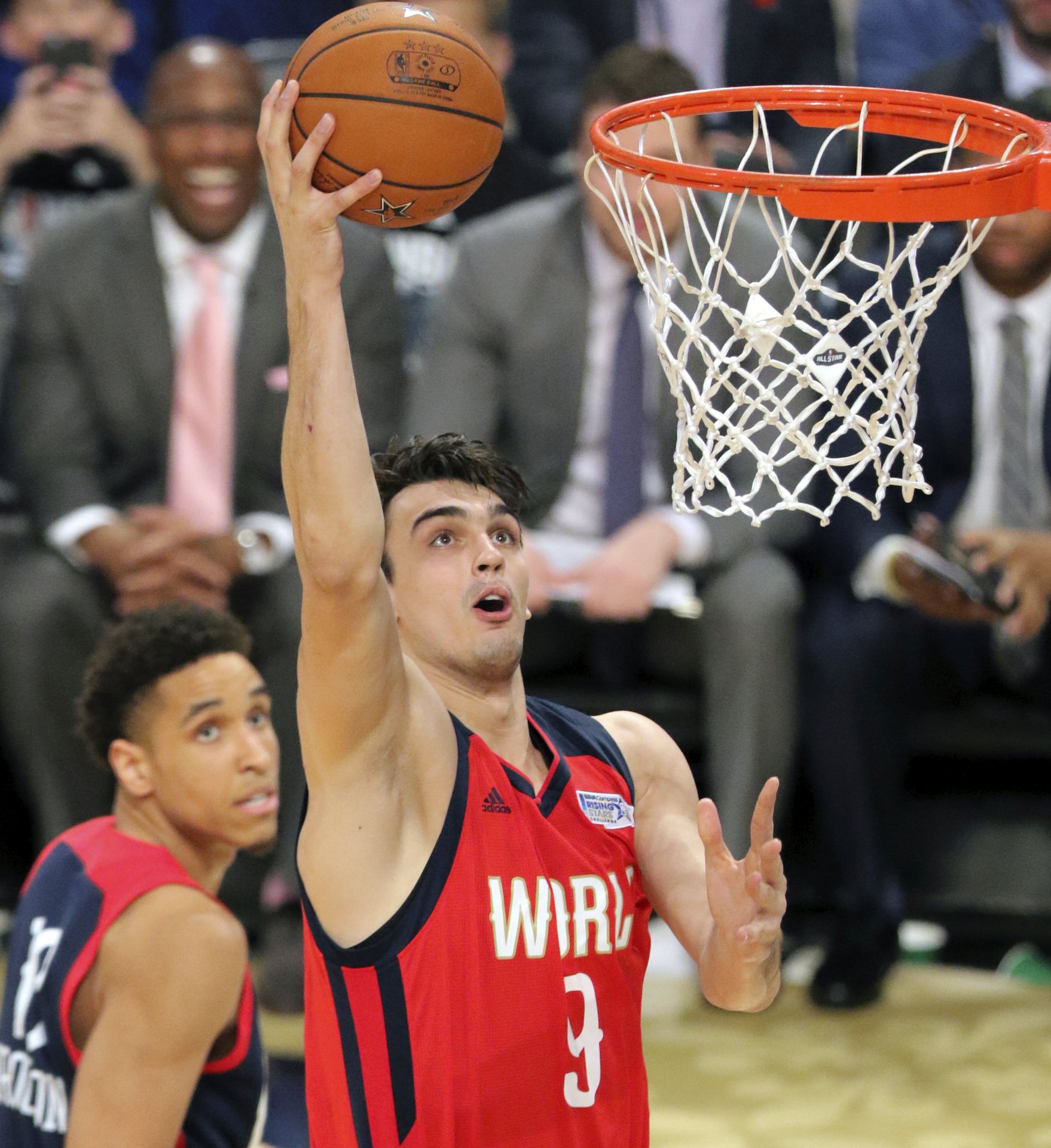 epa05800965 World Team player Dario Saric of Croatia goes to the basket against the United States team during the NBA Rising Stars Challenge at Smoothie King Center, part of the NBA All-Star weekend in New Orleans, Louisiana, 17 February 2017. The NBA All-Star Game will be played 19 February in New Orleans.  EPA/DAN ANDERSON