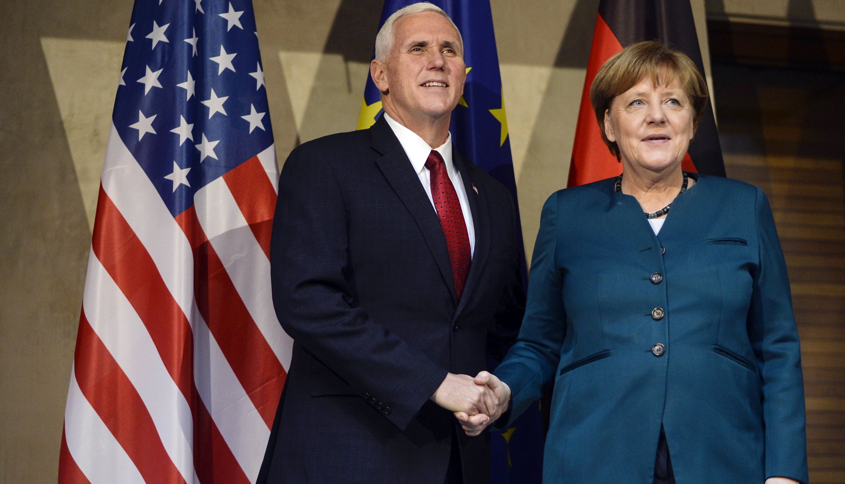 epa05801302 German Chancellor Angela Merkel (R) and US Vice President Mike Pence shake hands during a photo opportunity prior to bilateral talks during the 53rd Munich Security Conference (MSC) in Munich, Germany, 18 February 2017. In their annual meeting, politicians and various experts and guests from around the world discuss issues surrounding global security from February 17 to 19.  EPA/PHILIPP GUELLAND