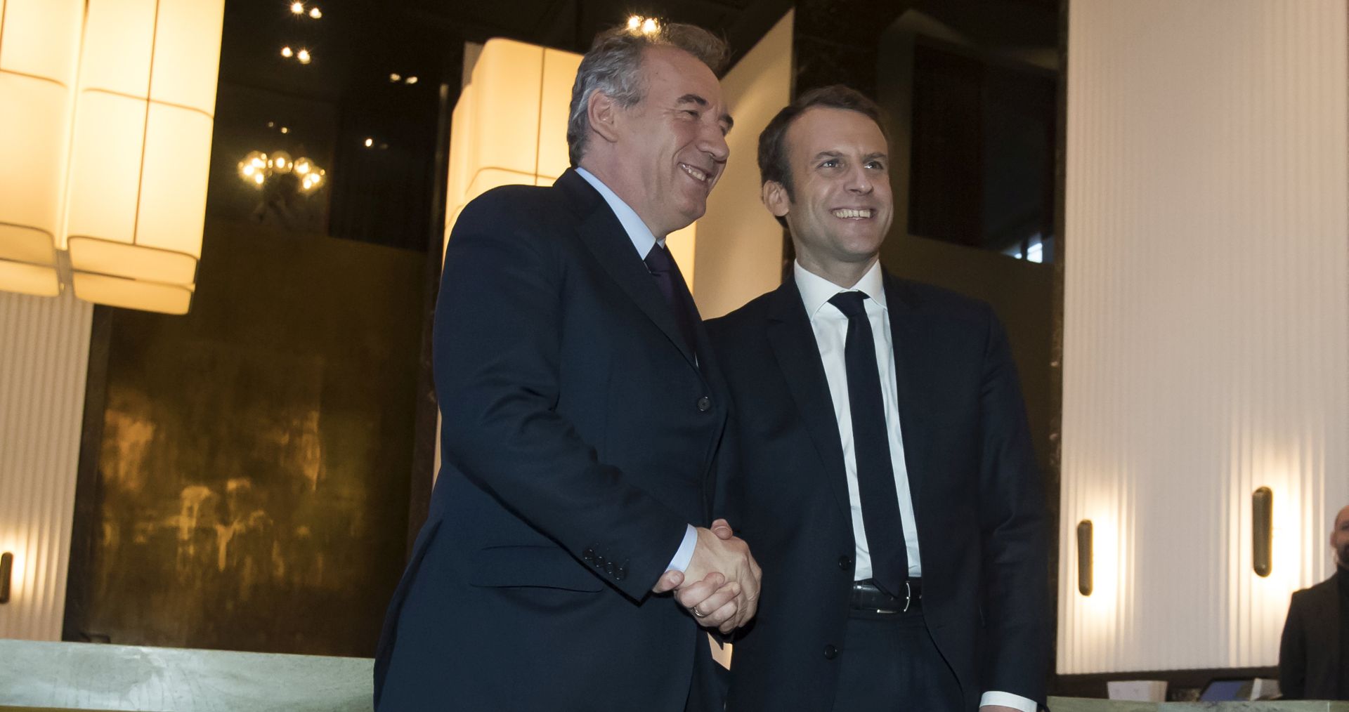 epa05810853 Democratic Movement (Modem) leader Francois Bayrou (L) and French presidential candidate Emmanuel Macron from his 'En March' political movement (R) pose for photographers before a news conference concerning their political alliance, ahead of the 2017 French presidential elections, in Paris, France, 23 February 2017. Former presidential candidate for the 2012 French presidential elections, Bayrou announced he is offering an alliance with independent candidate Macron in the next French presidential election race. French presidential elections are planned for 23 April and 07 May 2017.  EPA/IAN LANGSDON