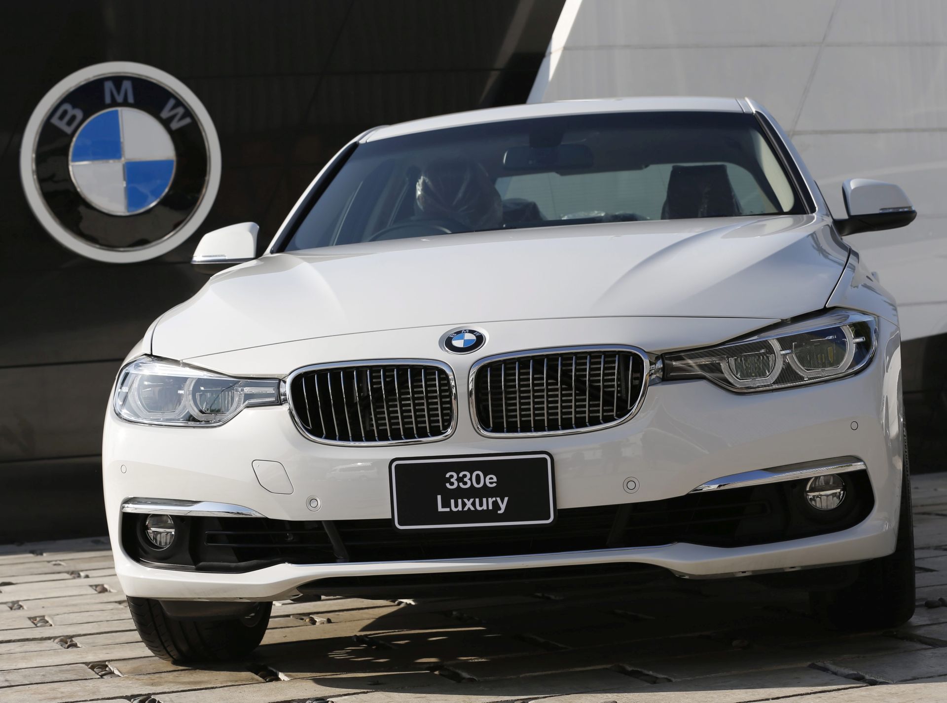 epa05764020 A BMW 330e Luxury plug-in hybrid car is displayed at the BMW Group Manufacturing plant in Rayong province, Thailand, 01 February 2017. The German carmaker BMW group starts its production line of BMW 330e Luxury and X5 xDrive40e M Sport plug-in hybrid cars at the BMW automaker production plant in Thailand, aimed to bring down the hybrid vehicle's costs and make it more affordable in the country. The Thai military junta government planned to promote investment in the automotive industry to make Thailand a regional production and export hub of hybrid vehicles.  EPA/RUNGROJ YONGRIT