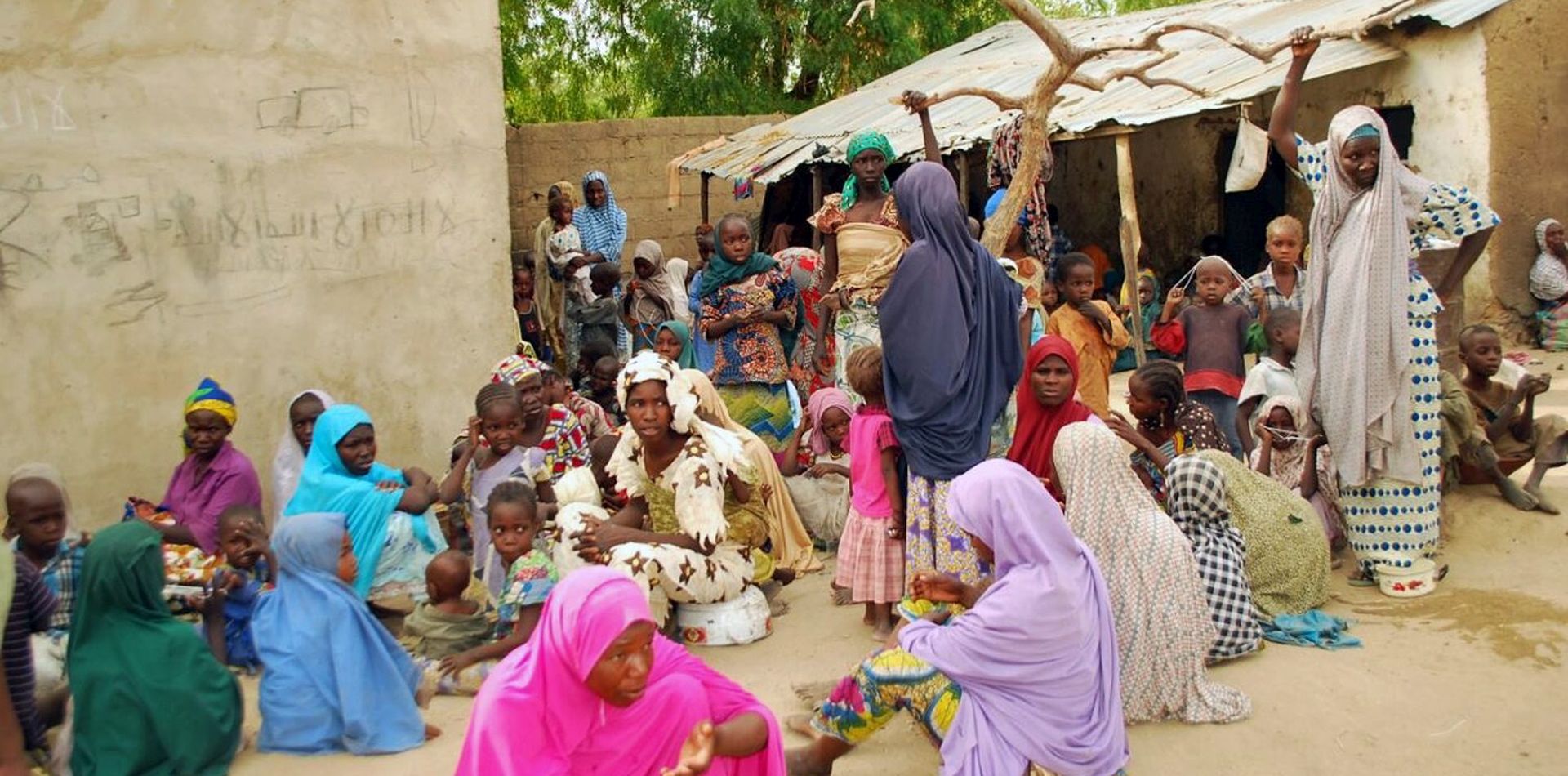 epa04727594 Some of the women and children rescued from insurgents by Nigerian troops, in Sambisa forest, Nigeria, 30 April 2015. According to a statement from the Nigerian military on 28 April 2015, 200 girls and 93 women have been freed from the hands of Islamist terrorist group Boko Haram. Military spokesman Chris Olukolade announced the military successfully liberated the women and girls in the region of Sambisa forest but the more than 200 girl students kidnapped from their school in the town of Chibok more than a year ago were not among those freed.  EPA/STR