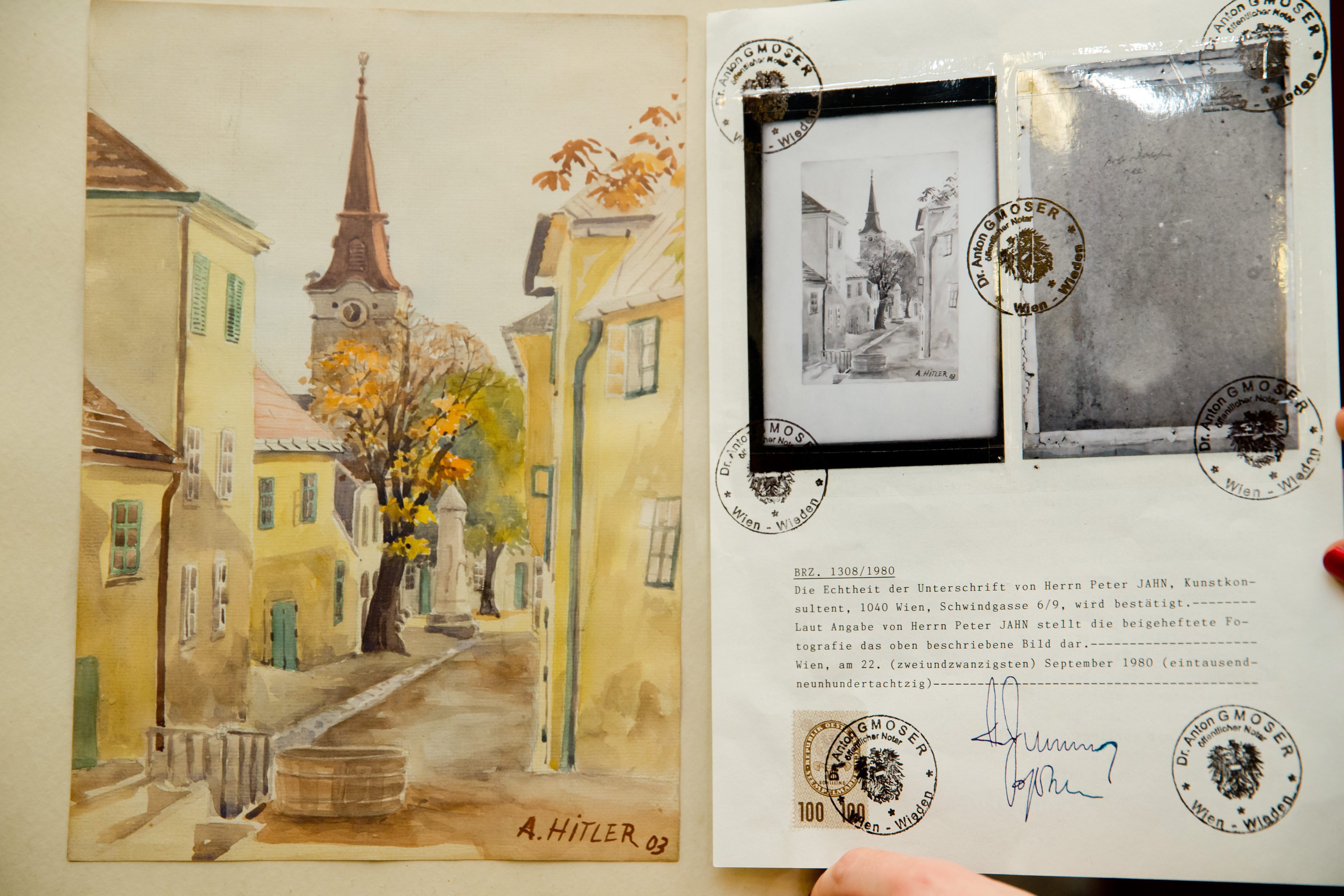 epa05145711 The painting 'Stadtansicht Gumpoldskirchen' from 1903, wich Adolf Hitles is attributed as author, is seen in a action house in Nurenberg, Germany, 06 February 2016. A total of 29 paitings of Adolf Hitler will be auctioned.  EPA/DANIEL KARMANN
