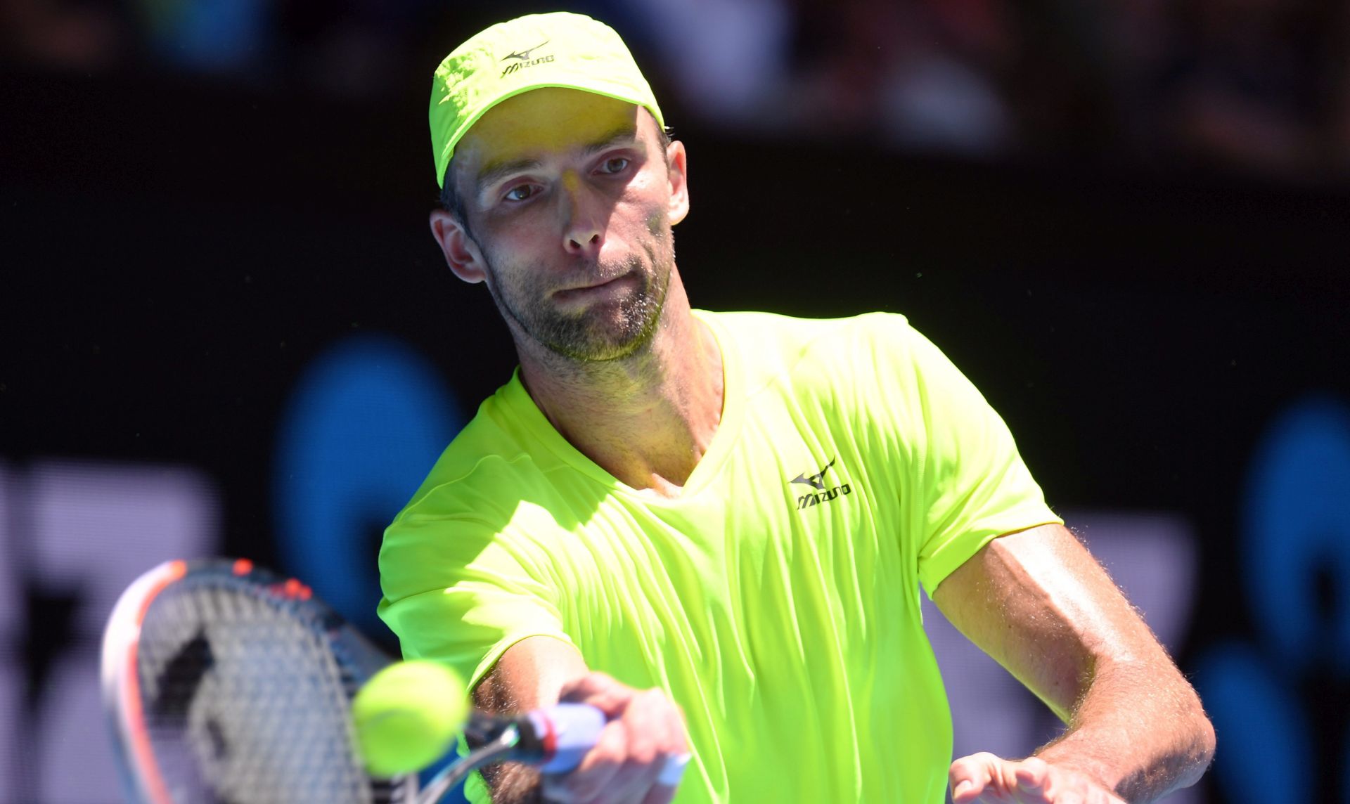 epa05736987 Ivo Karlovic of Croatia in action against David Goffin of Belgium during round three of the Men's Singles at the Australian Open Grand Slam tennis tournament in Melbourne, Victoria, Australia, 21 January 2017.  EPA/DEAN LEWINS AUSTRALIA AND NEW ZEALAND OUT